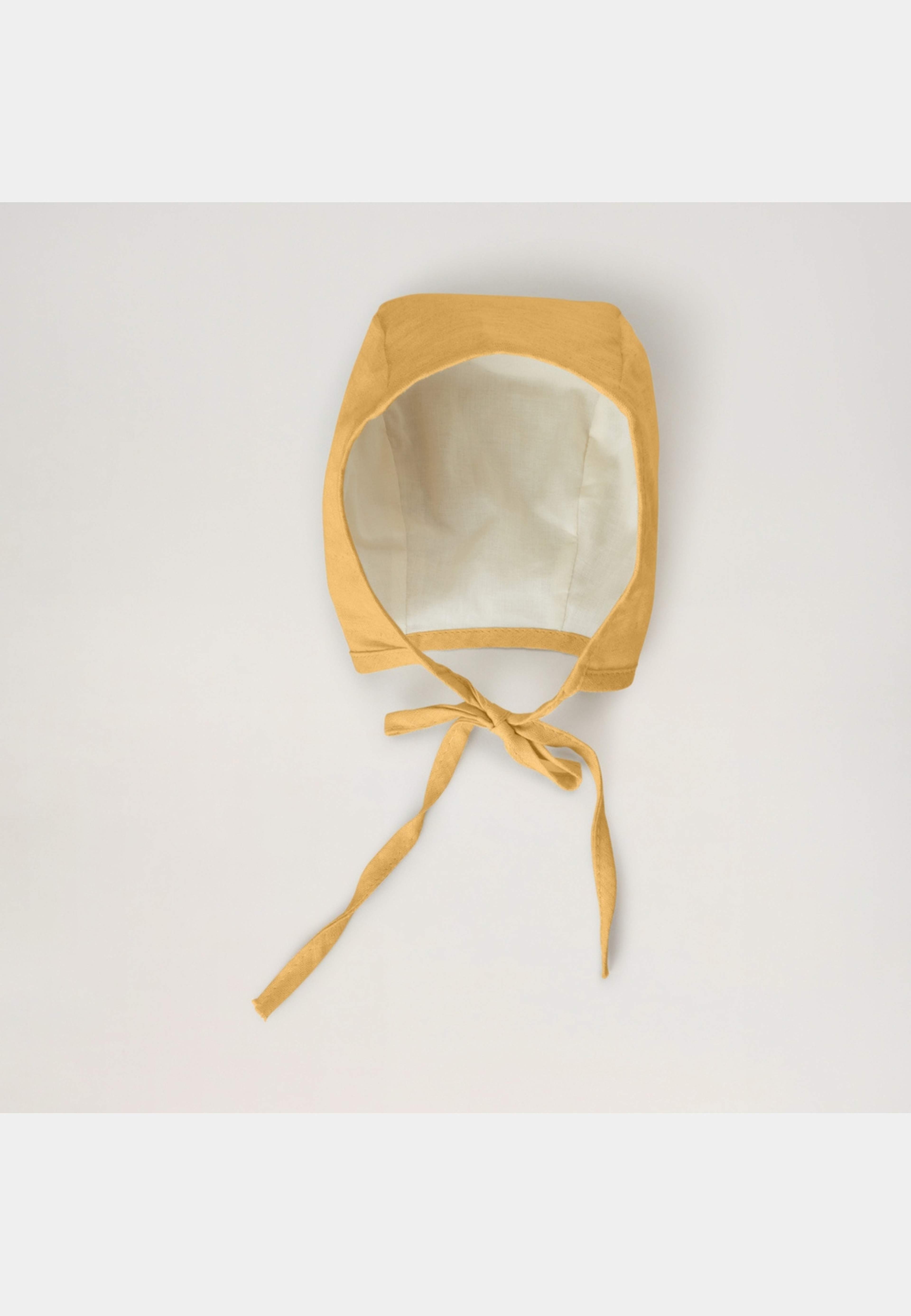 Linen Bonnet, från BabyMocs, i färgen yellow. Klicka för att öppna bilden i stort format