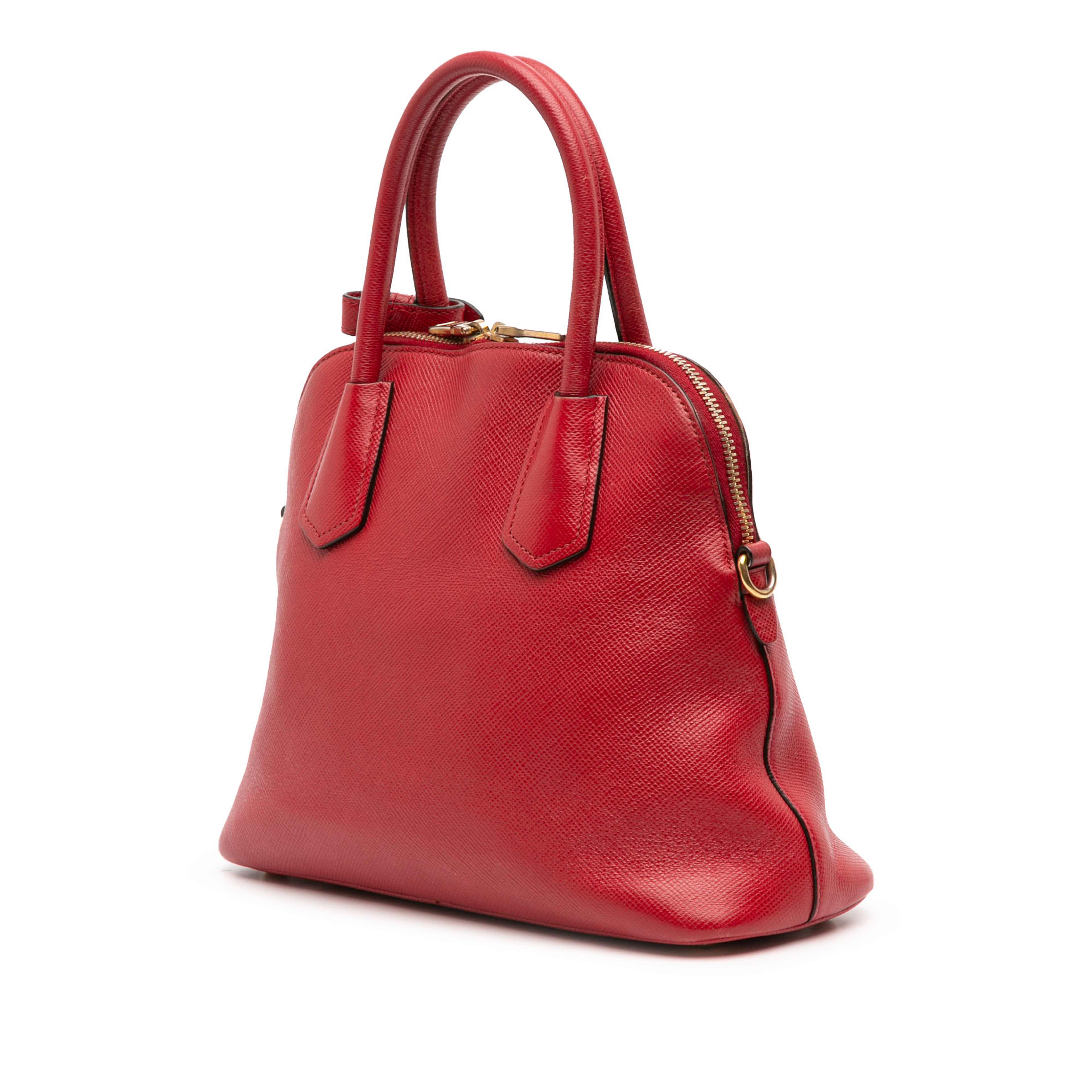 Prada Medium Saffiano Dome Satchel, från Luxclusif, i färgen red. Klicka för att öppna bilden i stort format
