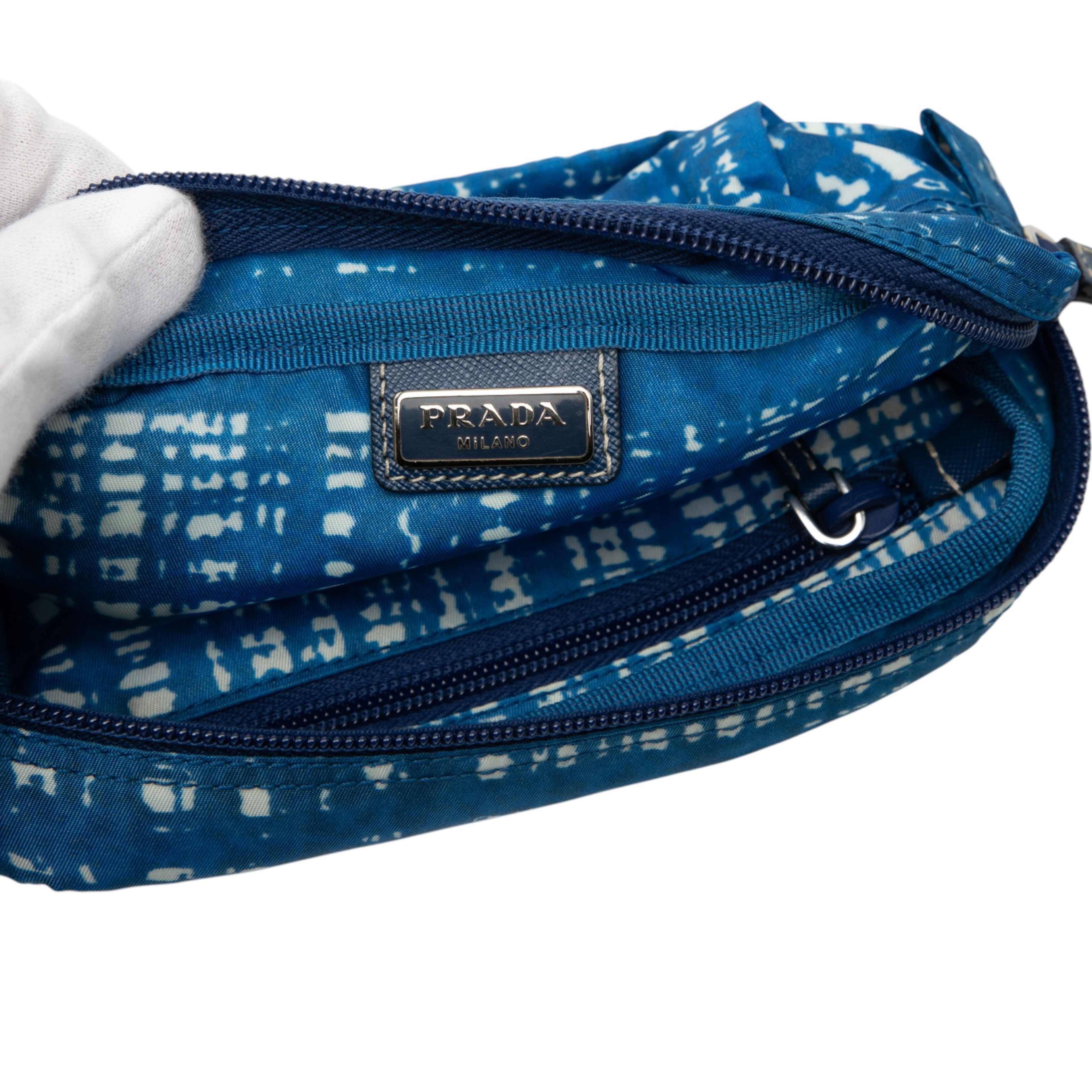 Prada Tessuto Stampato Cosmetic Pouch, från Luxclusif, i färgen blue. Klicka för att öppna bilden i stort format