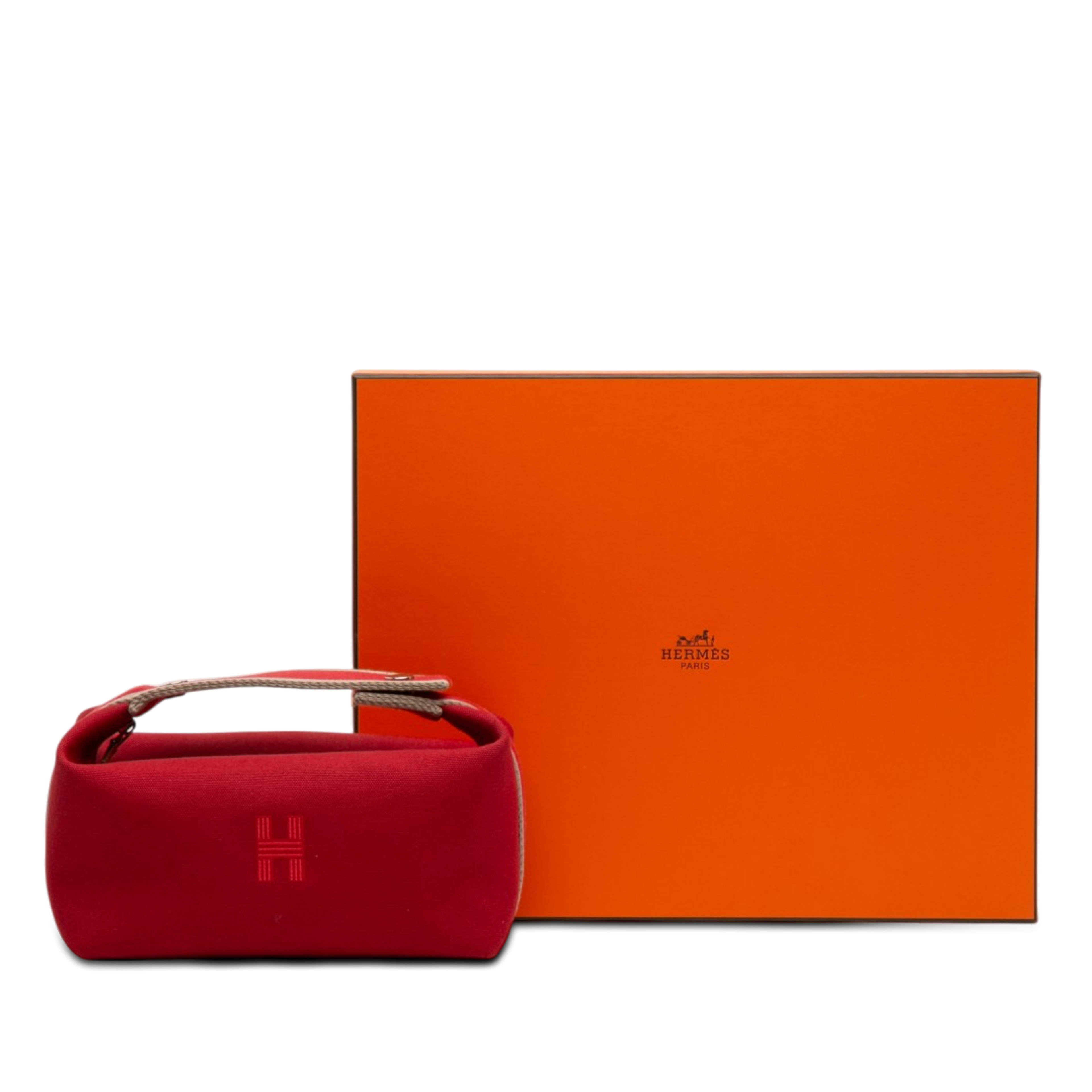 Hermès Small Toile Bride A Brac Case, från Luxclusif, i färgen röd. Klicka för att öppna bilden i stort format