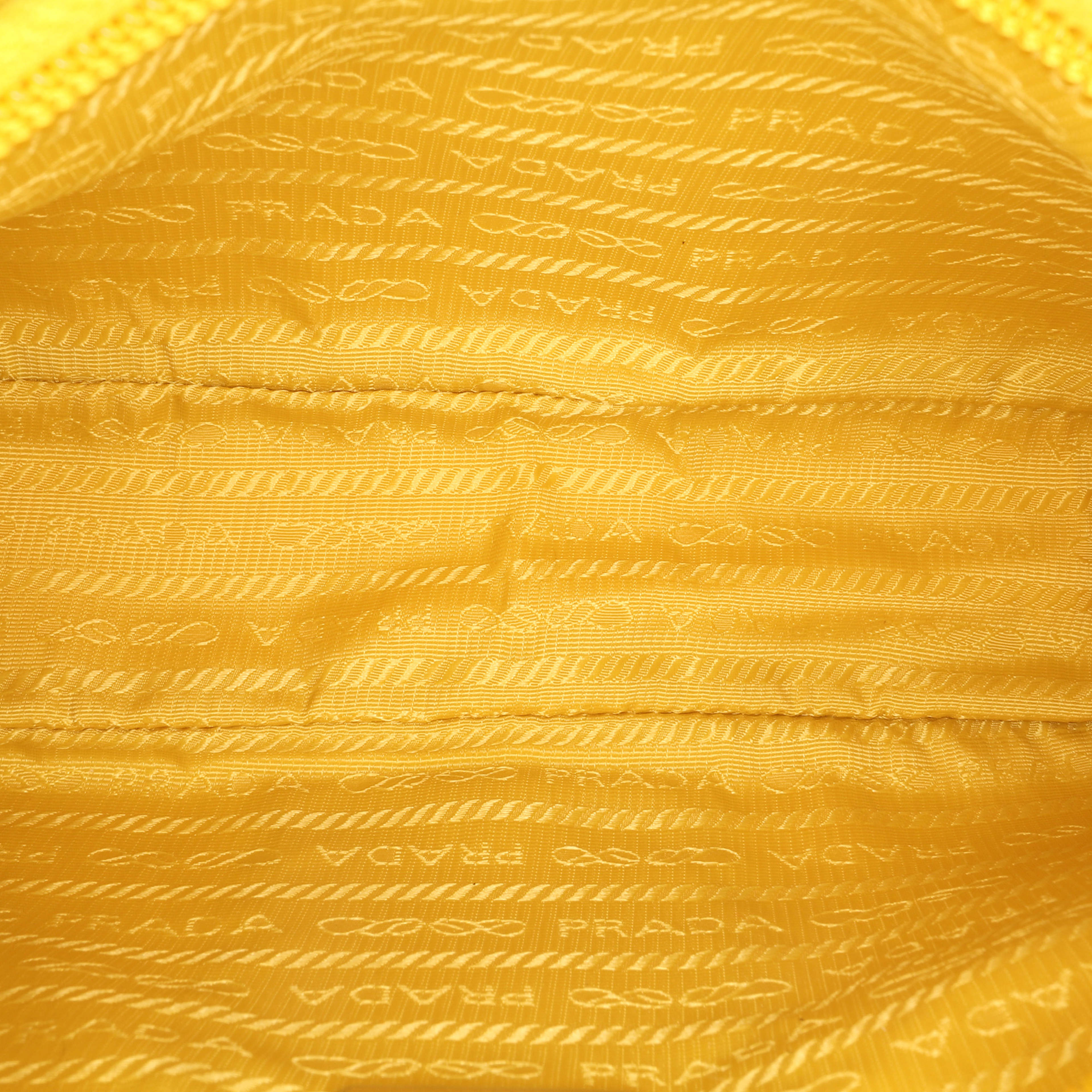 Prada Mini Tessuto Re-edition 2000 Shoulder Bag, från Luxclusif, i färgen yellow. Klicka för att öppna bilden i stort format