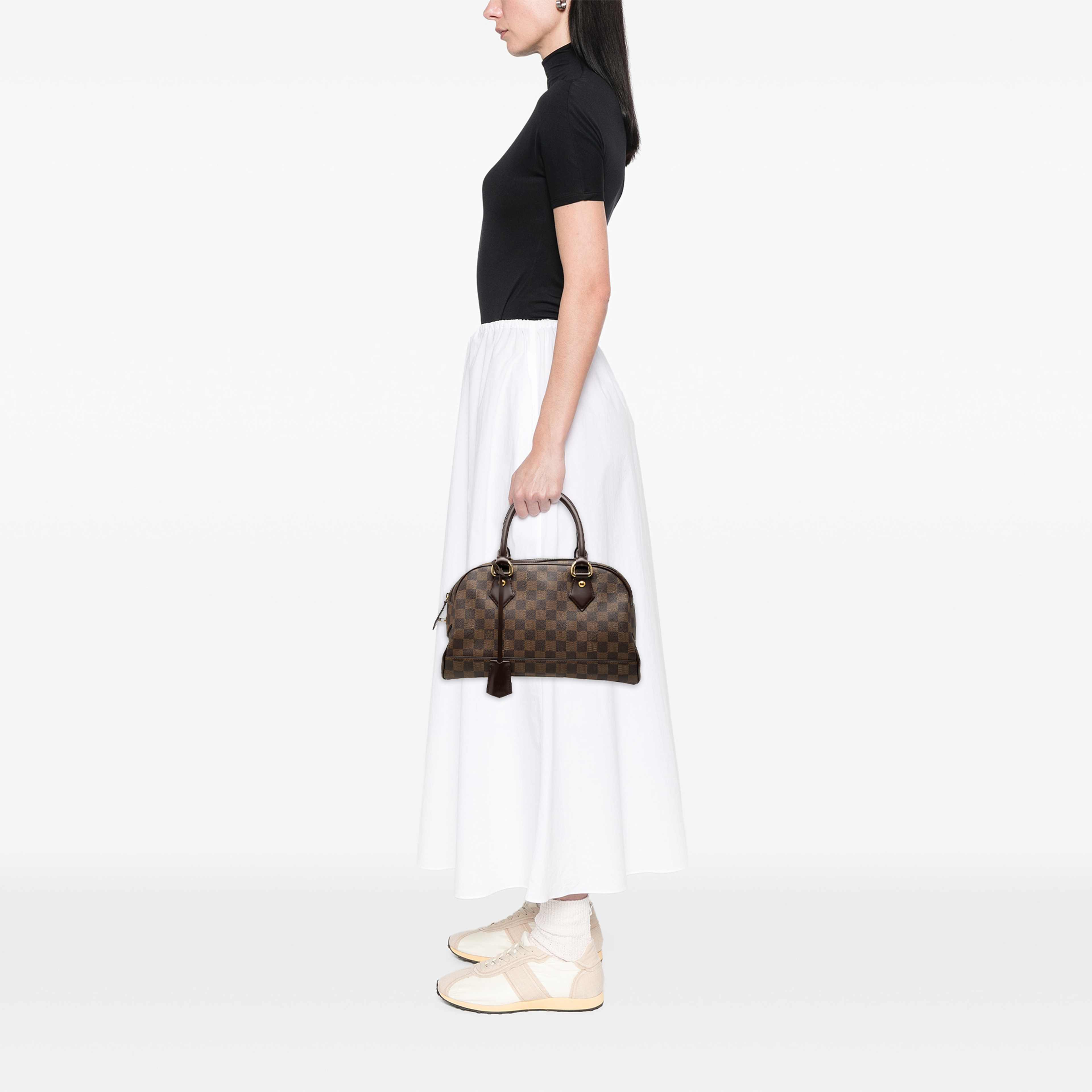 Louis Vuitton Damier Ebene Duomo, från Luxclusif, i färgen brun. Klicka för att öppna bilden i stort format