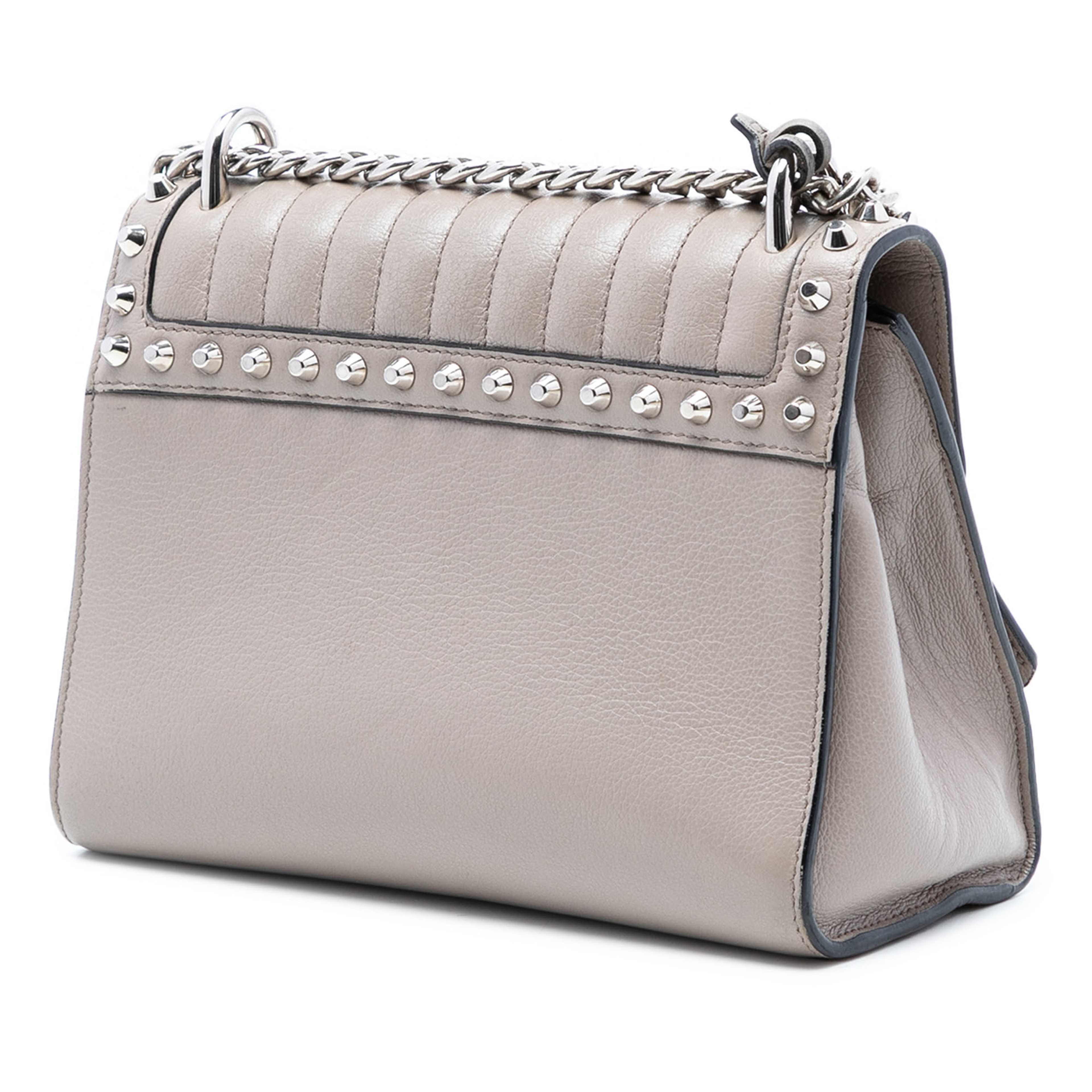 Prada Studded Glace Calf Sound Lock Crossbody, från Luxclusif, i färgen grå. Klicka för att öppna bilden i stort format