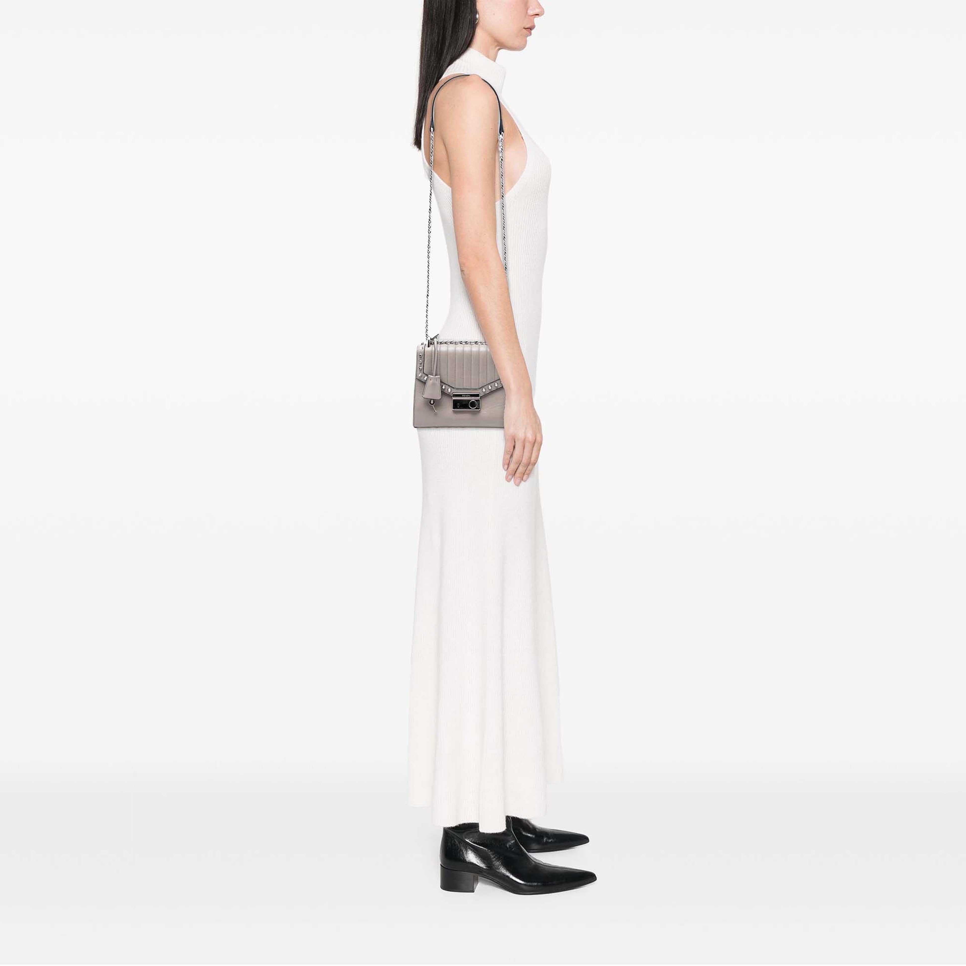 Prada Studded Glace Calf Sound Lock Crossbody, från Luxclusif, i färgen grå. Klicka för att öppna bilden i stort format