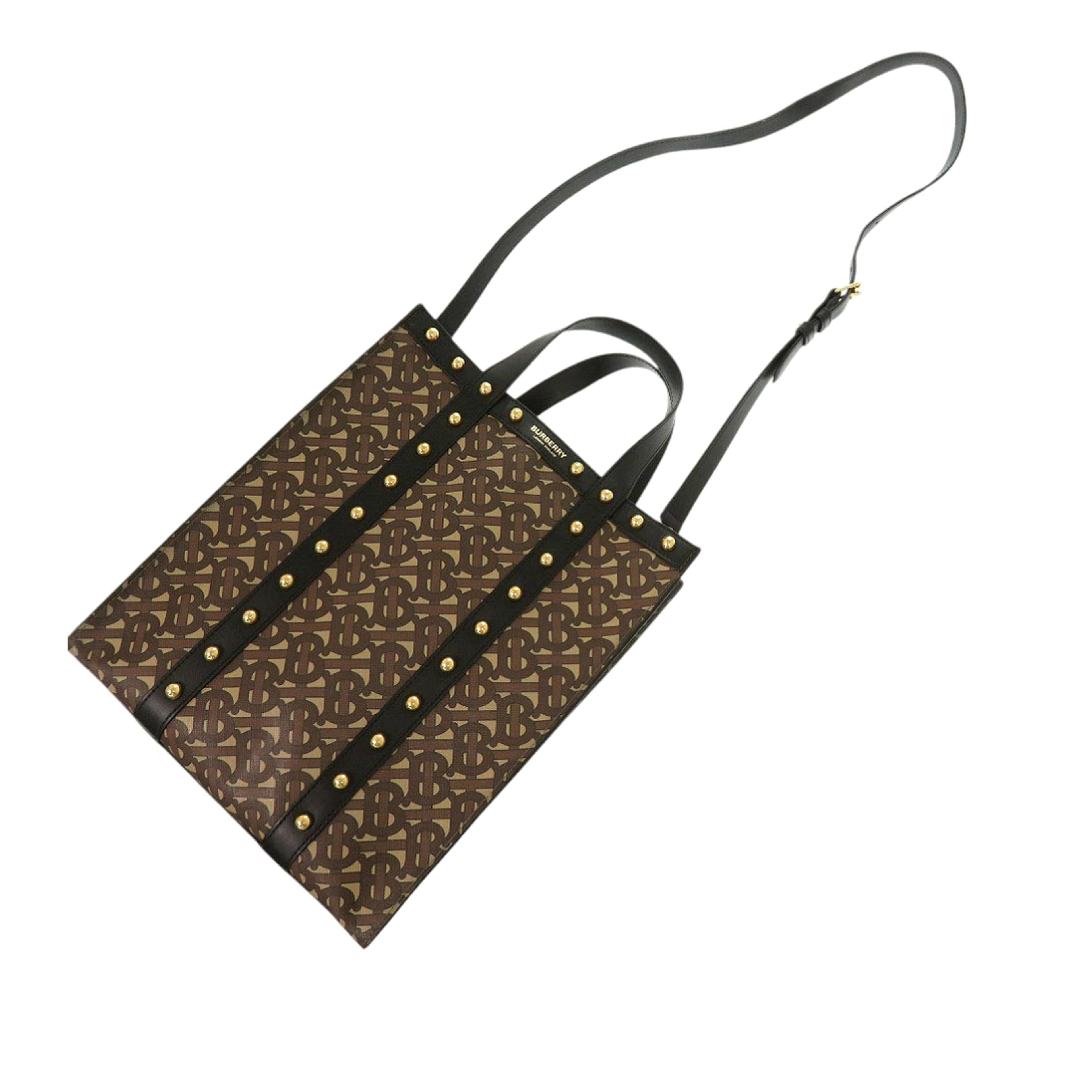 Burberry Small Tb Monogram E Canvas And Studded Leather Vertical Tote, från Luxclusif, i färgen brun. Klicka för att öppna bilden i stort format