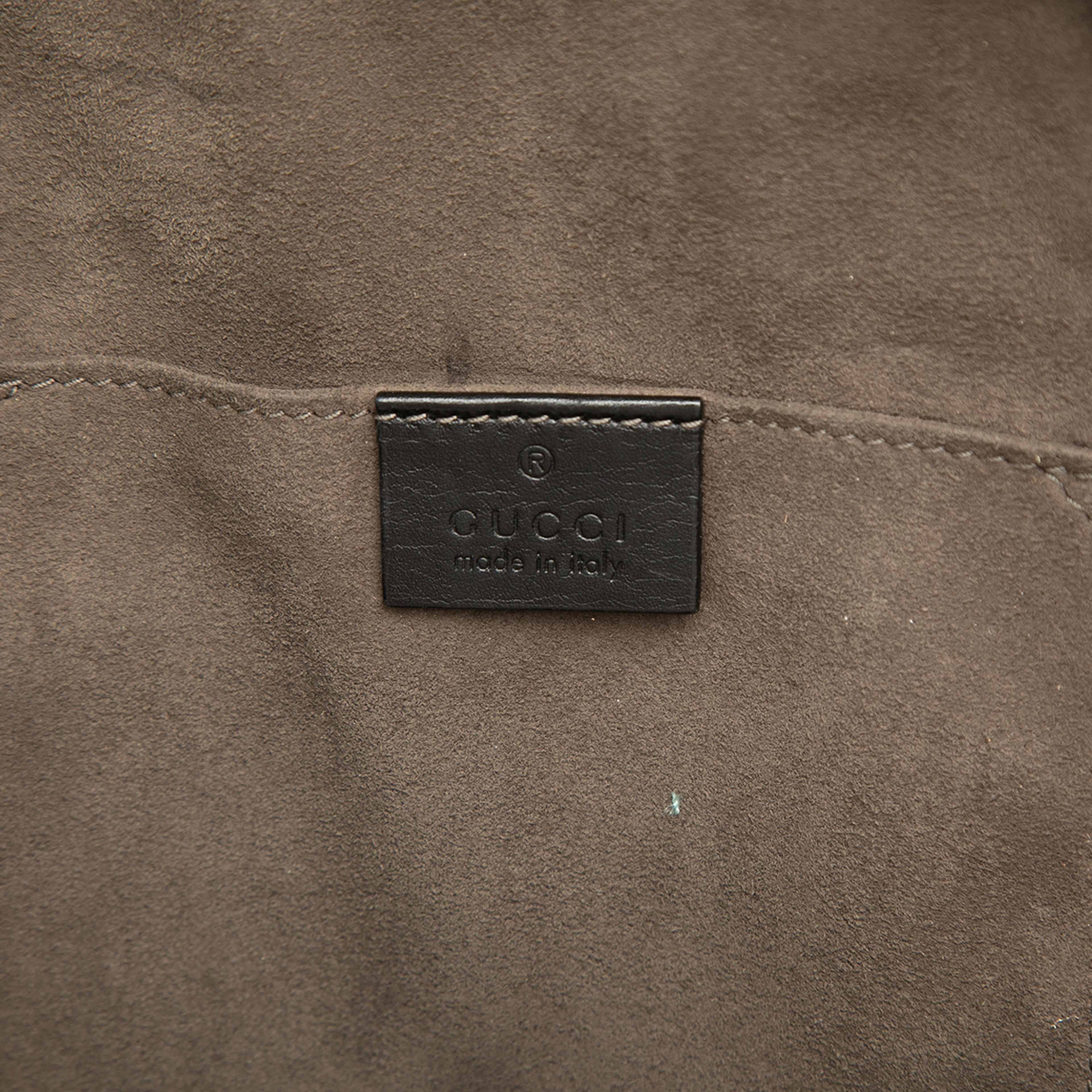 Gucci Guccissima Sling Backpack, från Luxclusif, i färgen svart. Klicka för att öppna bilden i stort format