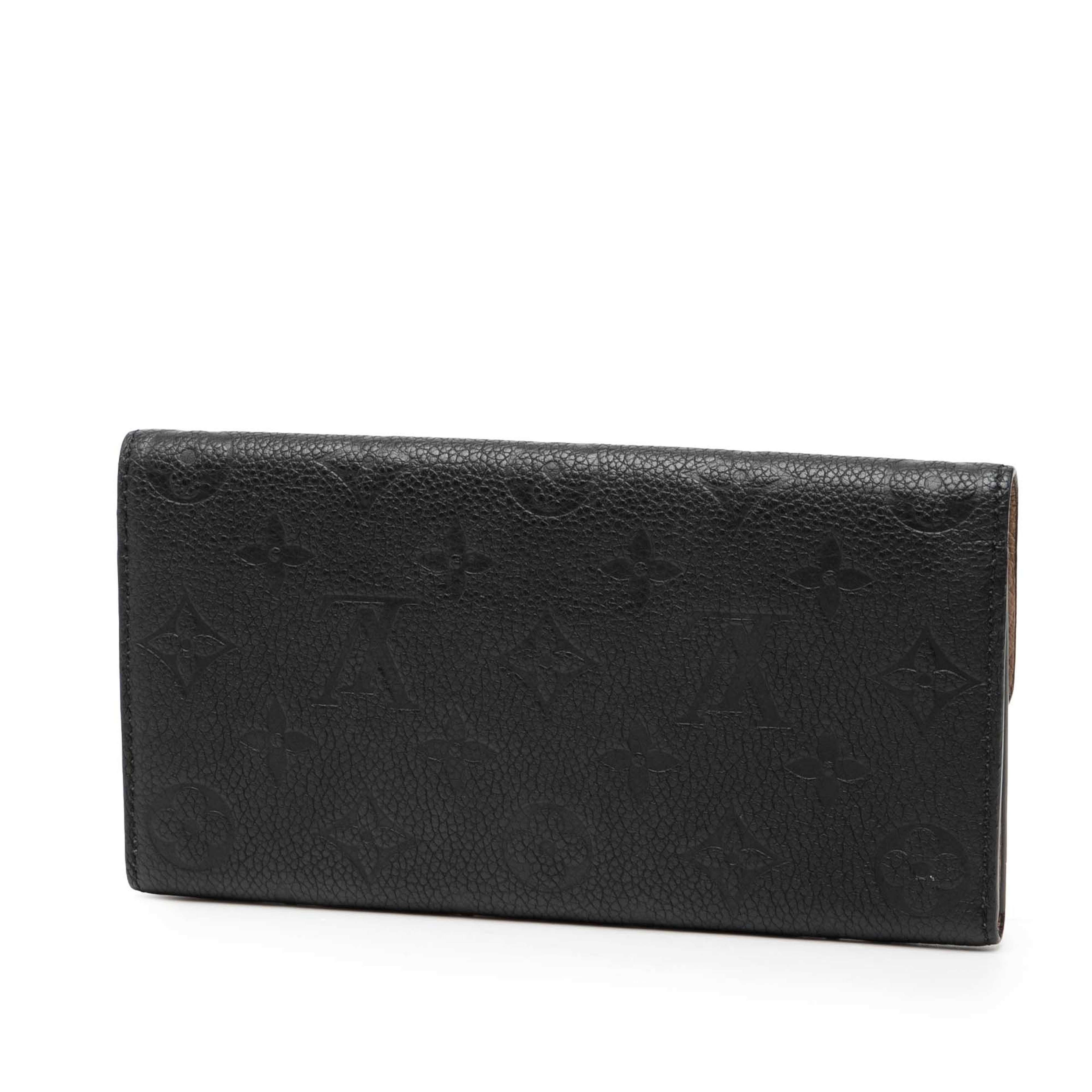 Louis Vuitton Monogram Empreinte Emilie Wallet, från Luxclusif, i färgen black. Klicka för att öppna bilden i stort format