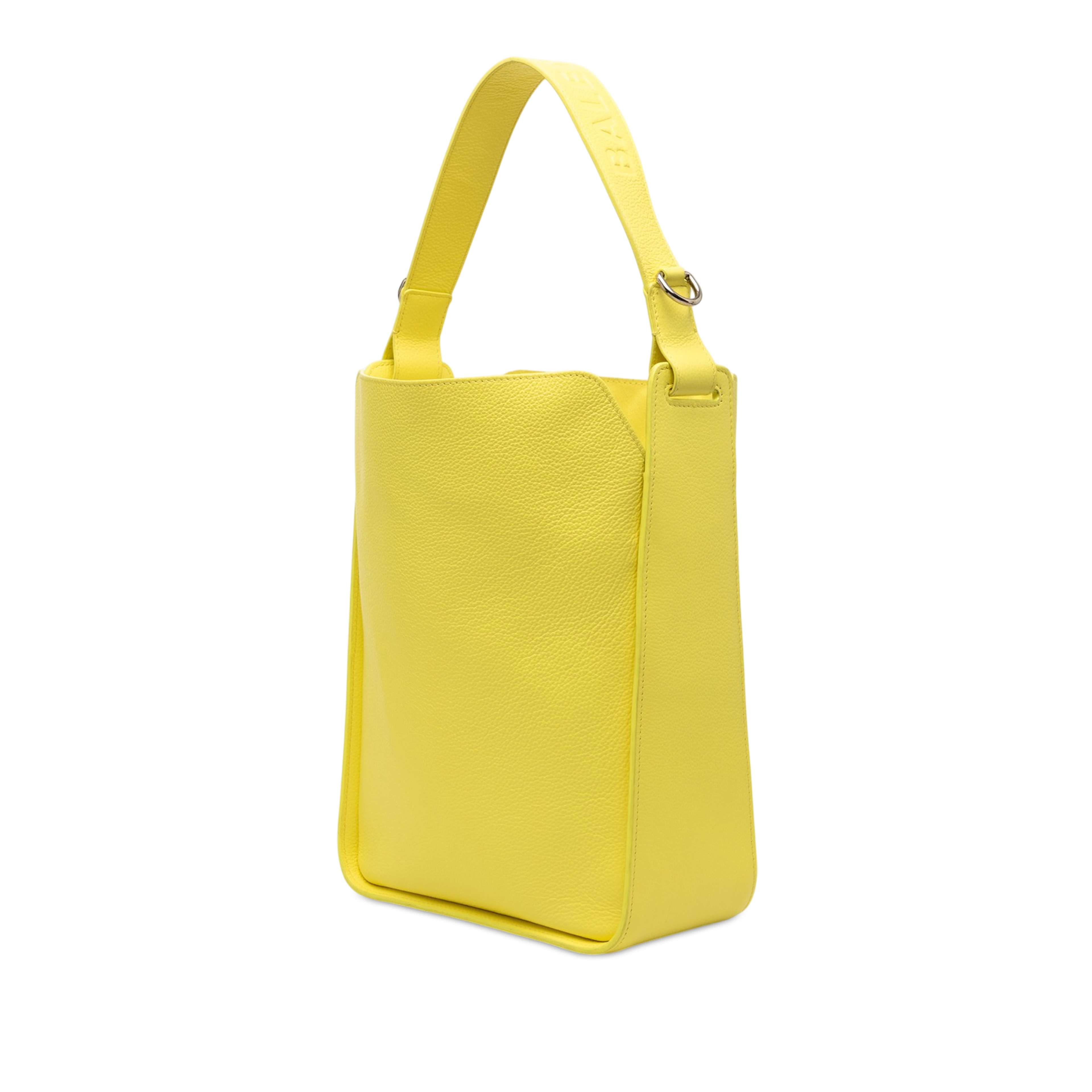 Balenciaga Small Pebbled Calfskin Tool 2.0 North South Tote, från Luxclusif, i färgen gul. Klicka för att öppna bilden i stort format