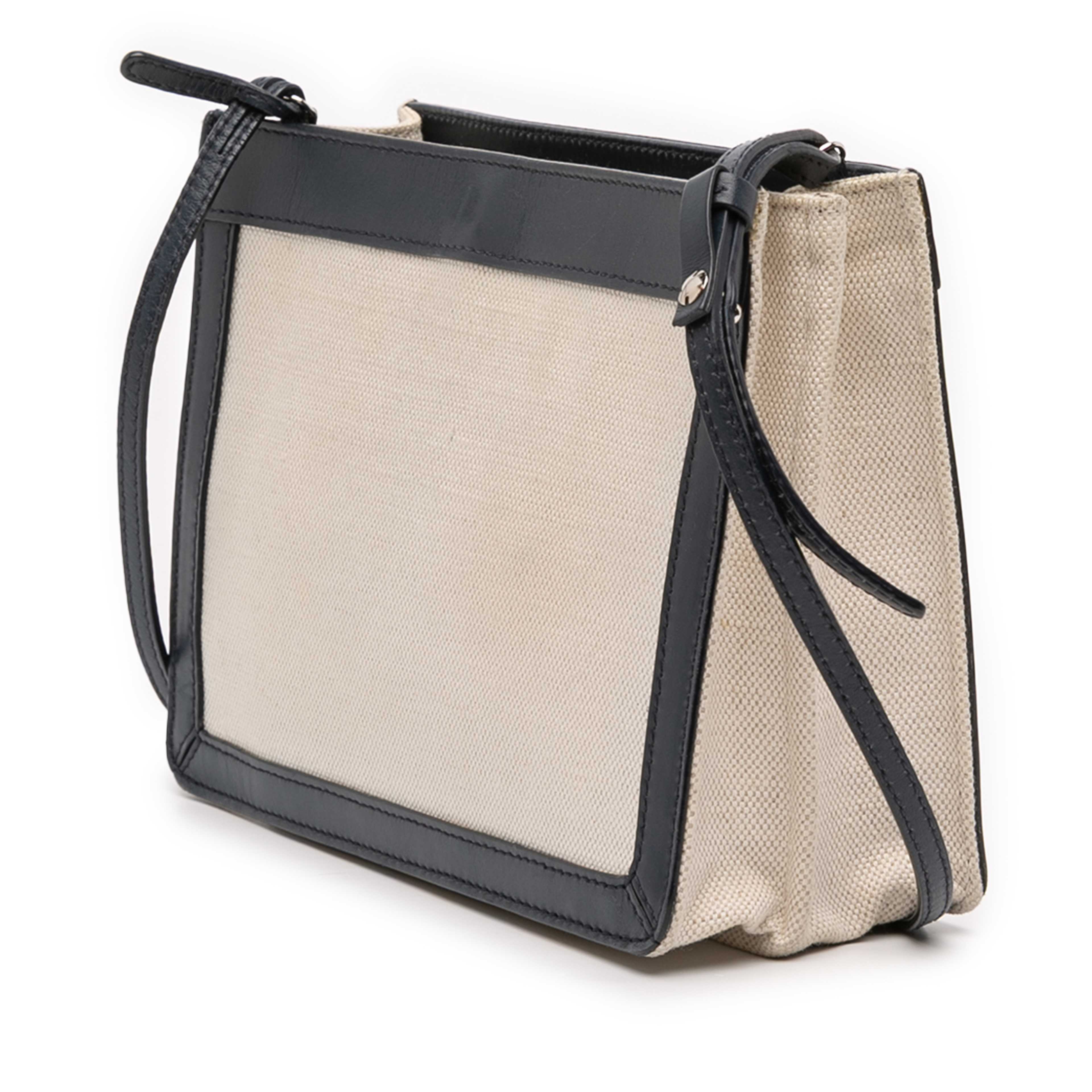 Balenciaga Canvas Navy Pochette Crossbody, från Luxclusif, i färgen light beige. Klicka för att öppna bilden i stort format