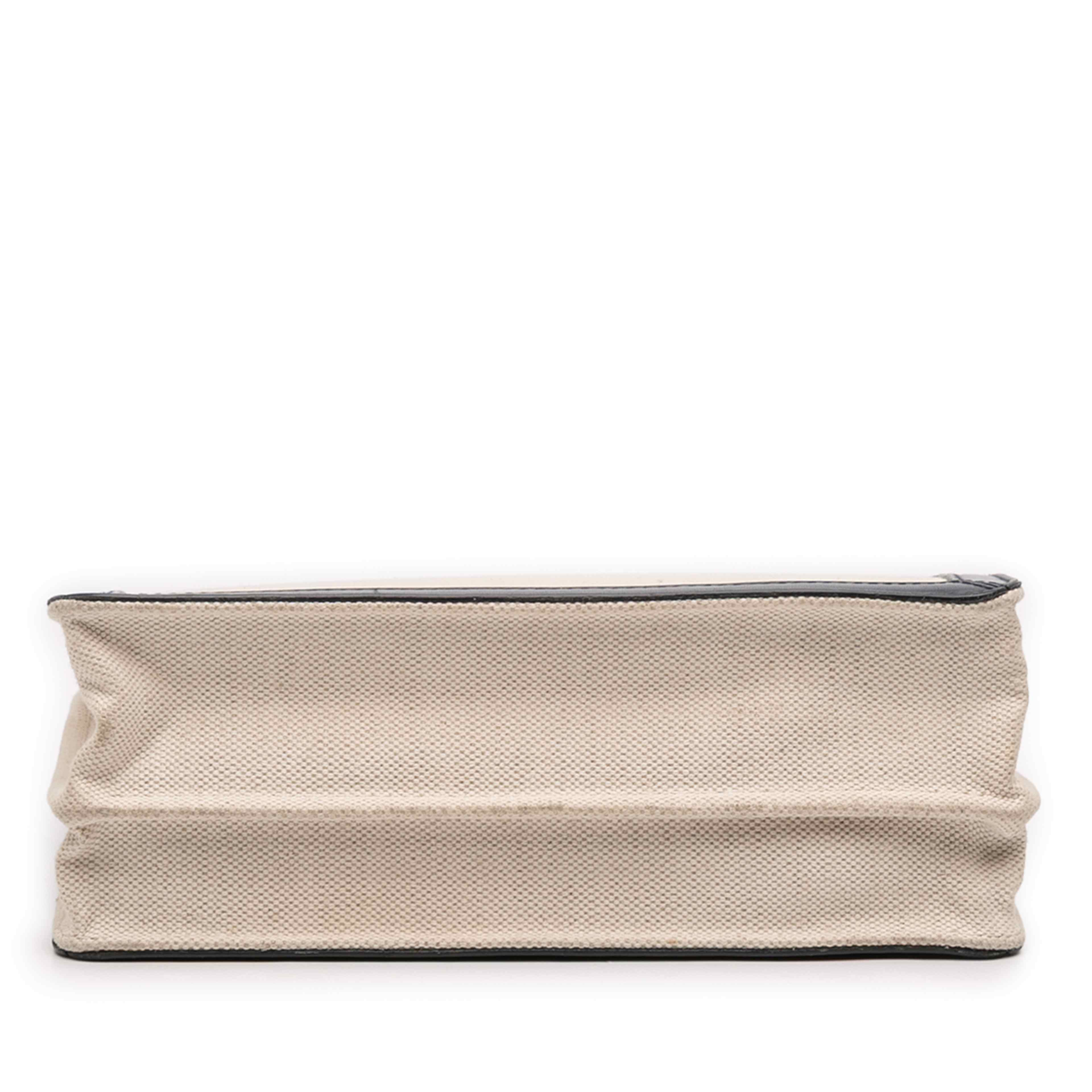 Balenciaga Canvas Navy Pochette Crossbody, från Luxclusif, i färgen light beige. Klicka för att öppna bilden i stort format