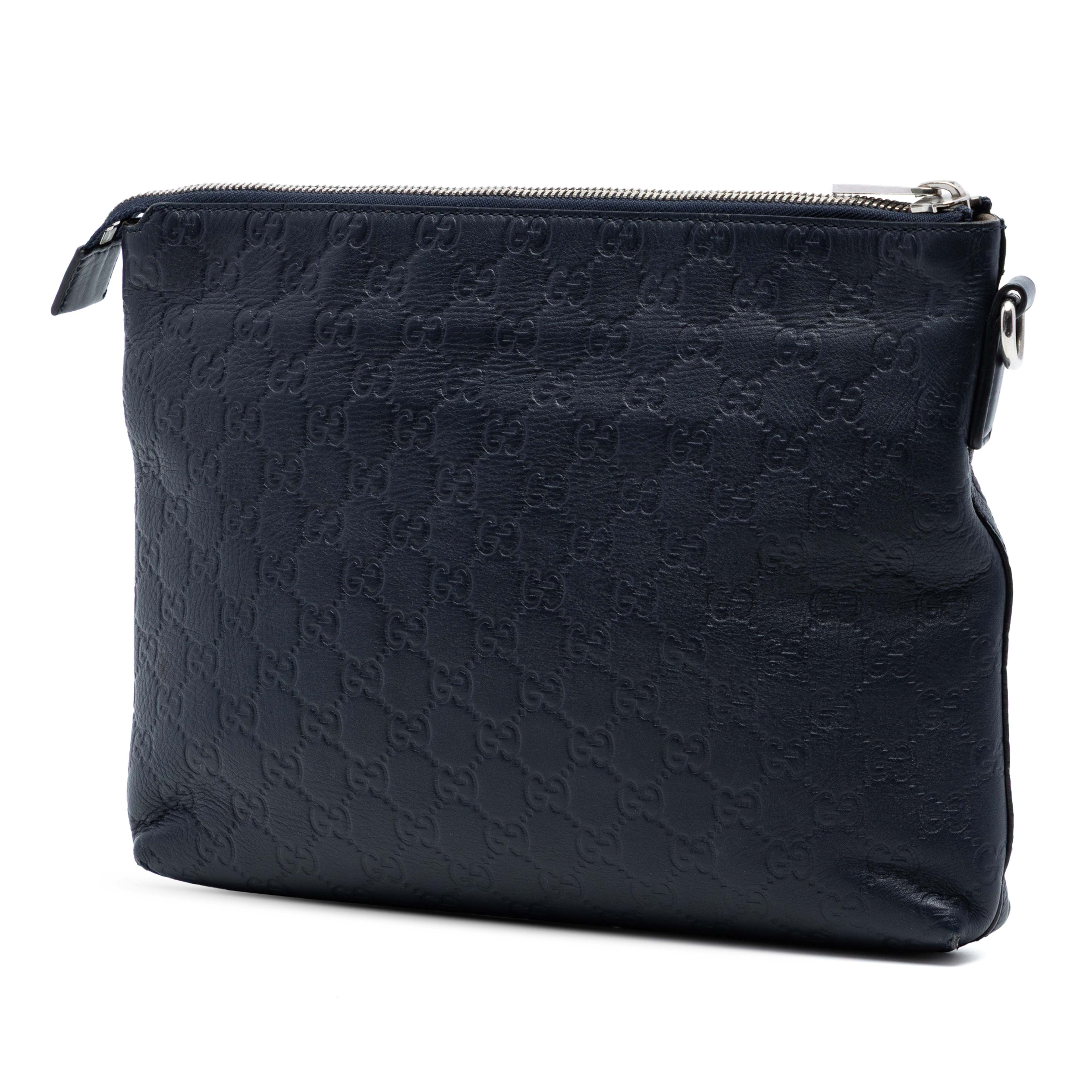 Gucci Guccissima Wristlet Clutch, från Luxclusif, i färgen navy. Klicka för att öppna bilden i stort format