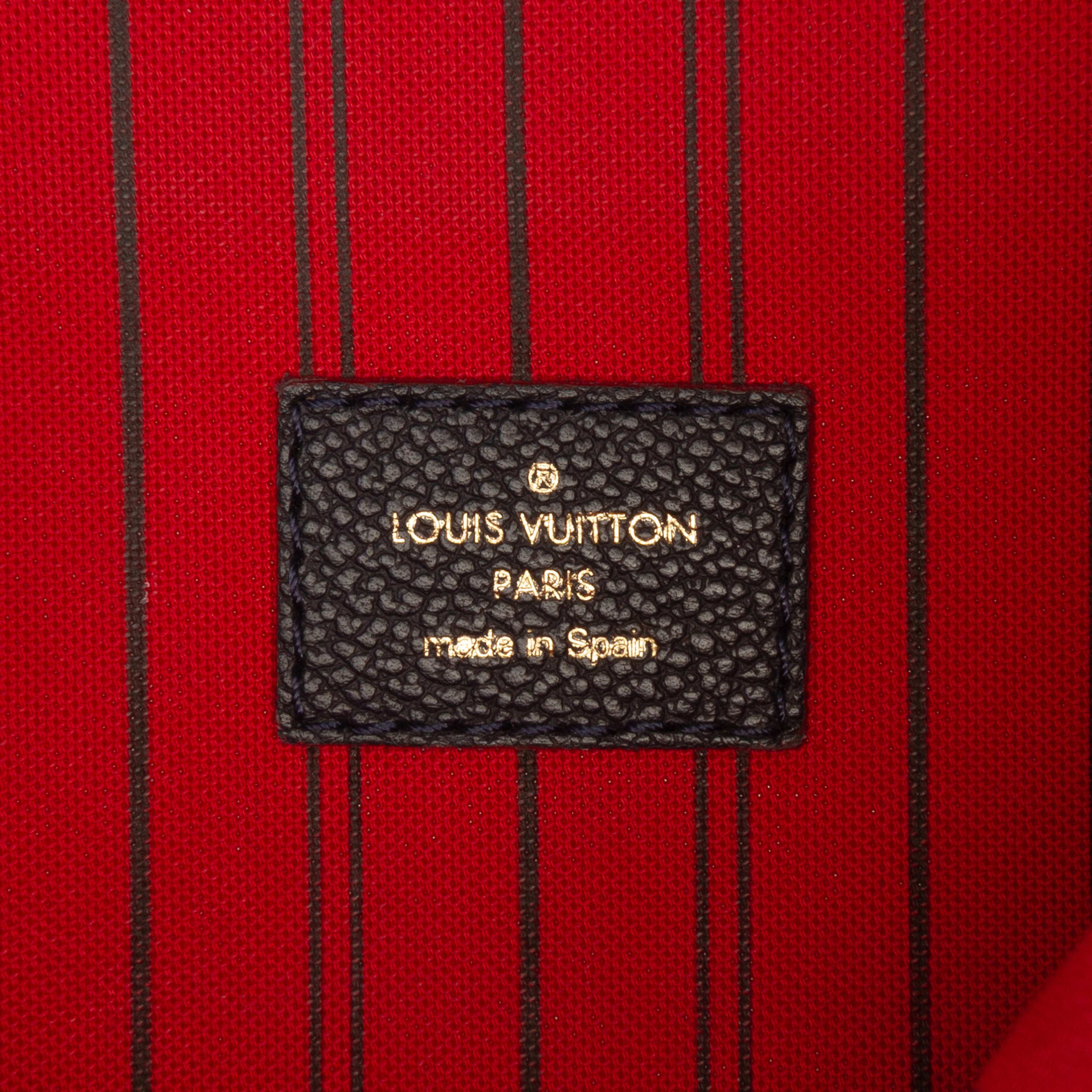 Louis Vuitton Monogram Empreinte Pochette Metis, från Luxclusif, i färgen navy. Klicka för att öppna bilden i stort format