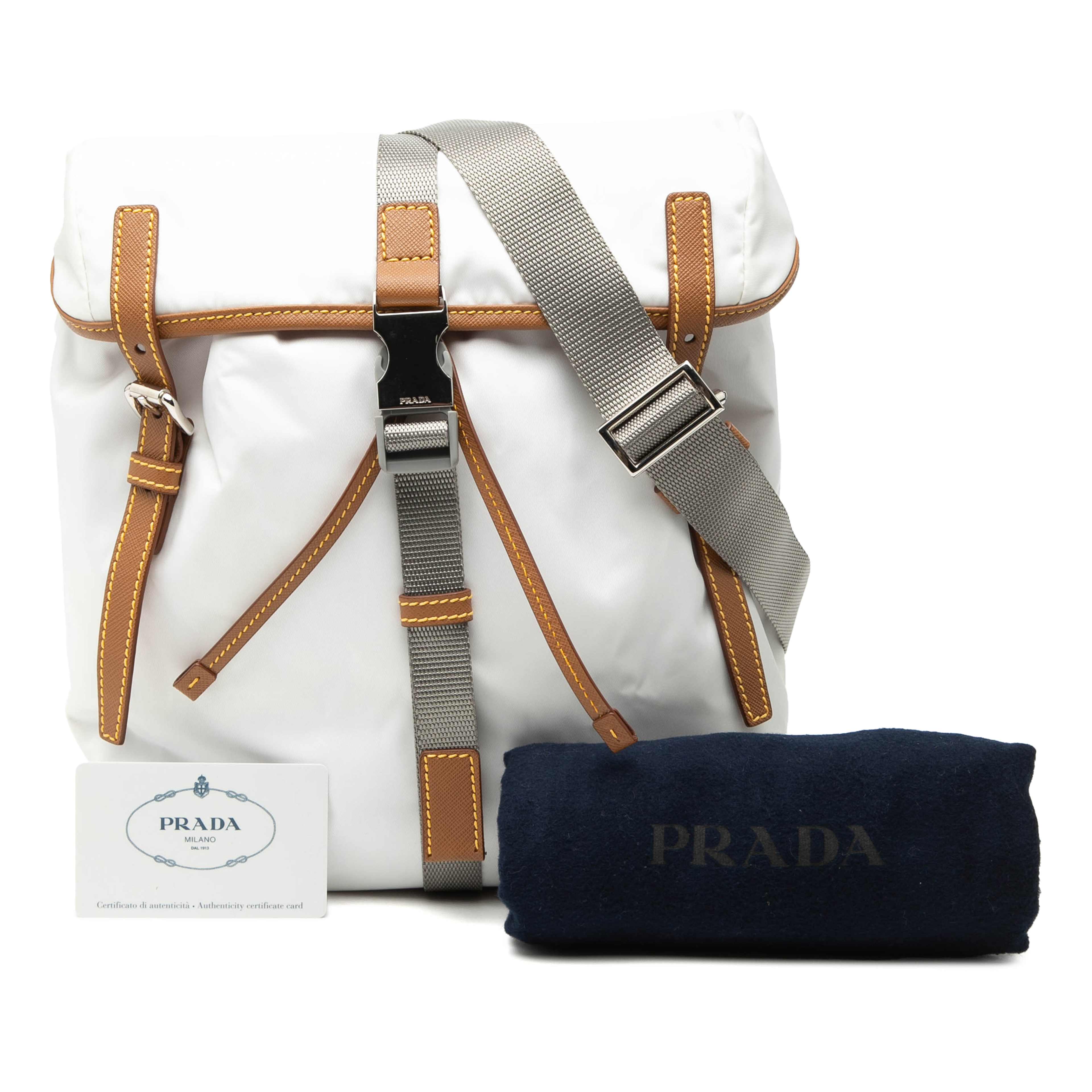 Prada Saffiano Trimmed Tessuto Triple Buckle Messenger Bag, från Luxclusif, i färgen vit. Klicka för att öppna bilden i stort format