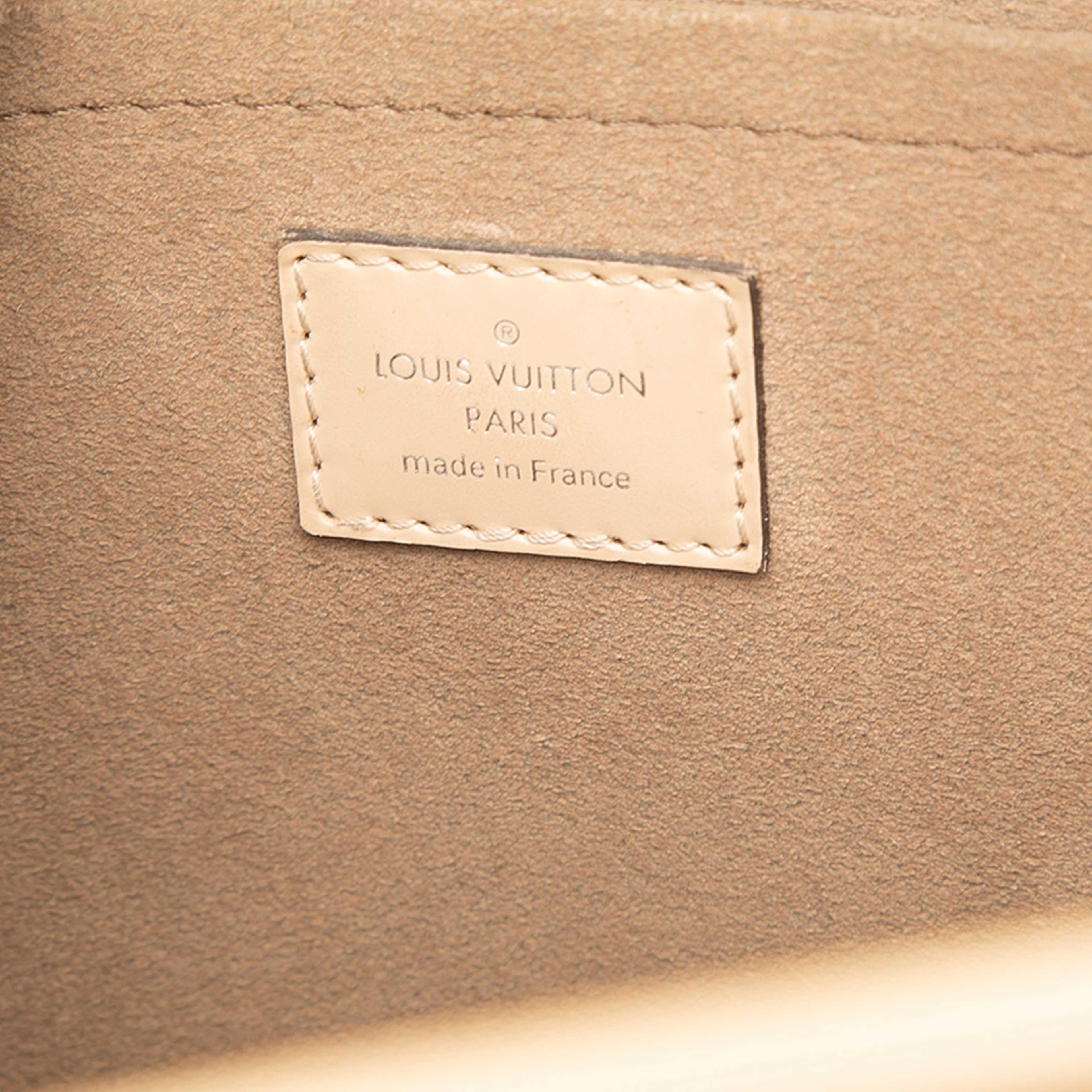 Louis Vuitton Epi Marly Mm, från Luxclusif, i färgen beige. Klicka för att öppna bilden i stort format
