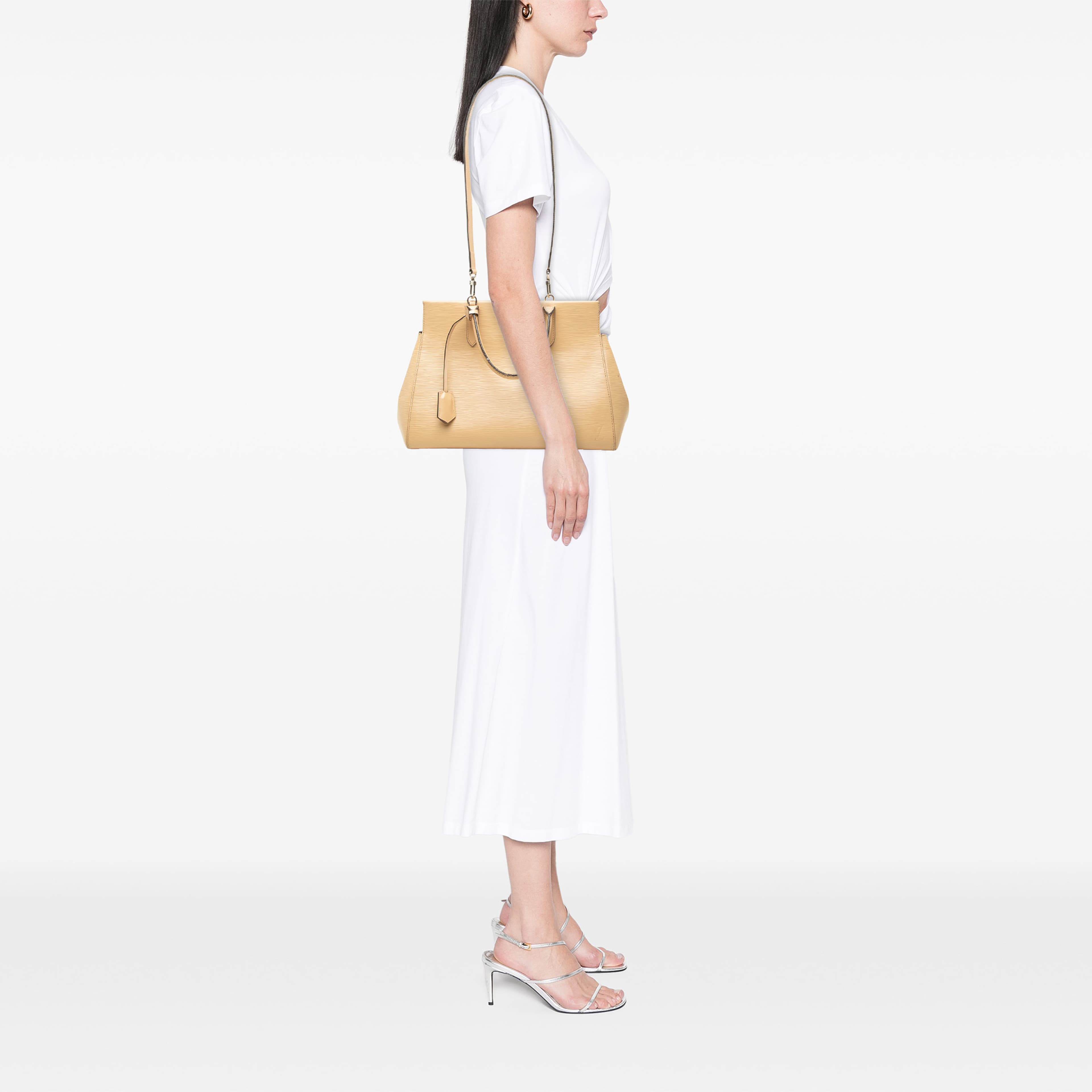Louis Vuitton Epi Marly Mm, från Luxclusif, i färgen beige. Klicka för att öppna bilden i stort format