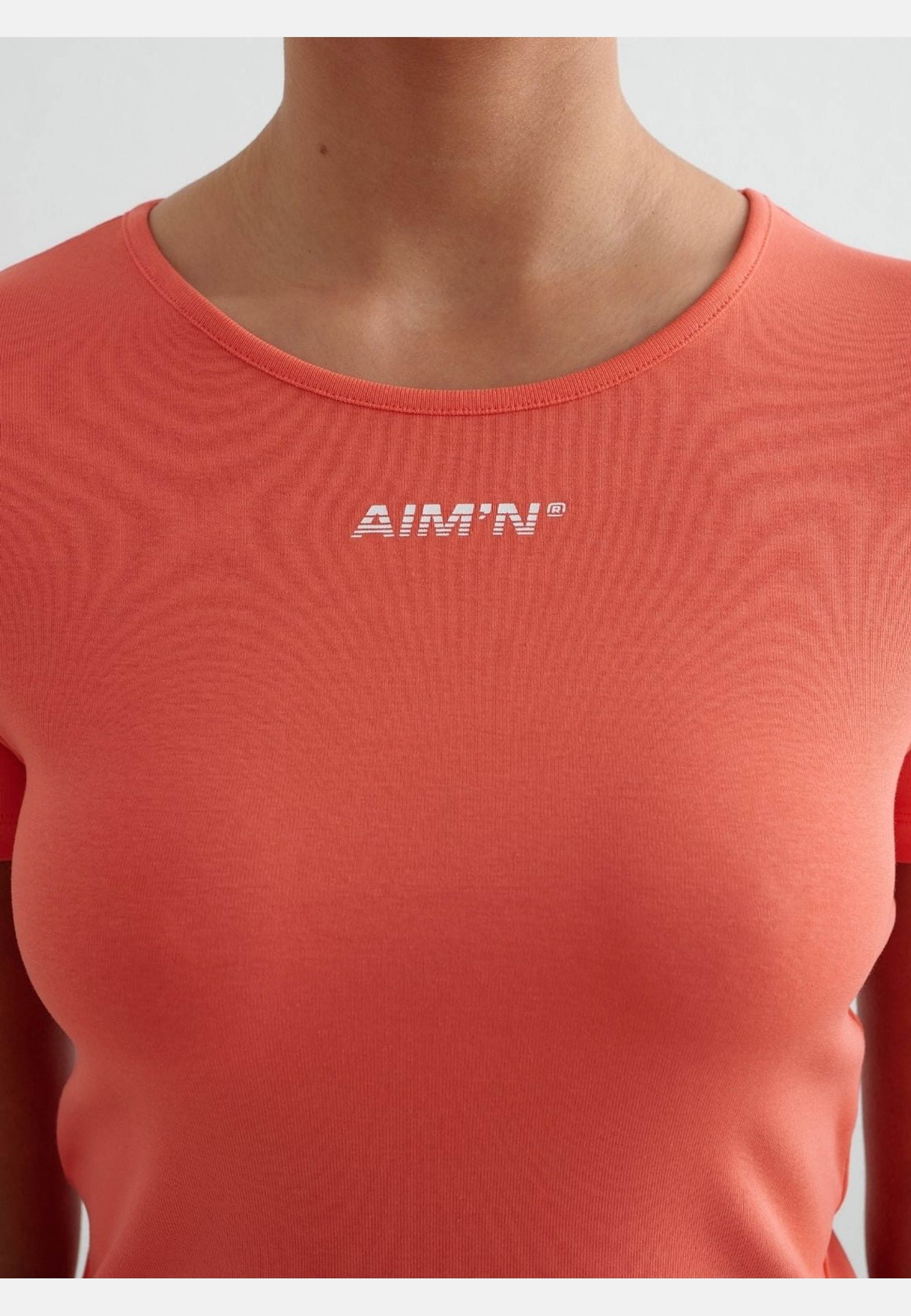 Stretch T-shirt, från aim'n, i färgen tangerine. Klicka för att öppna bilden i stort format