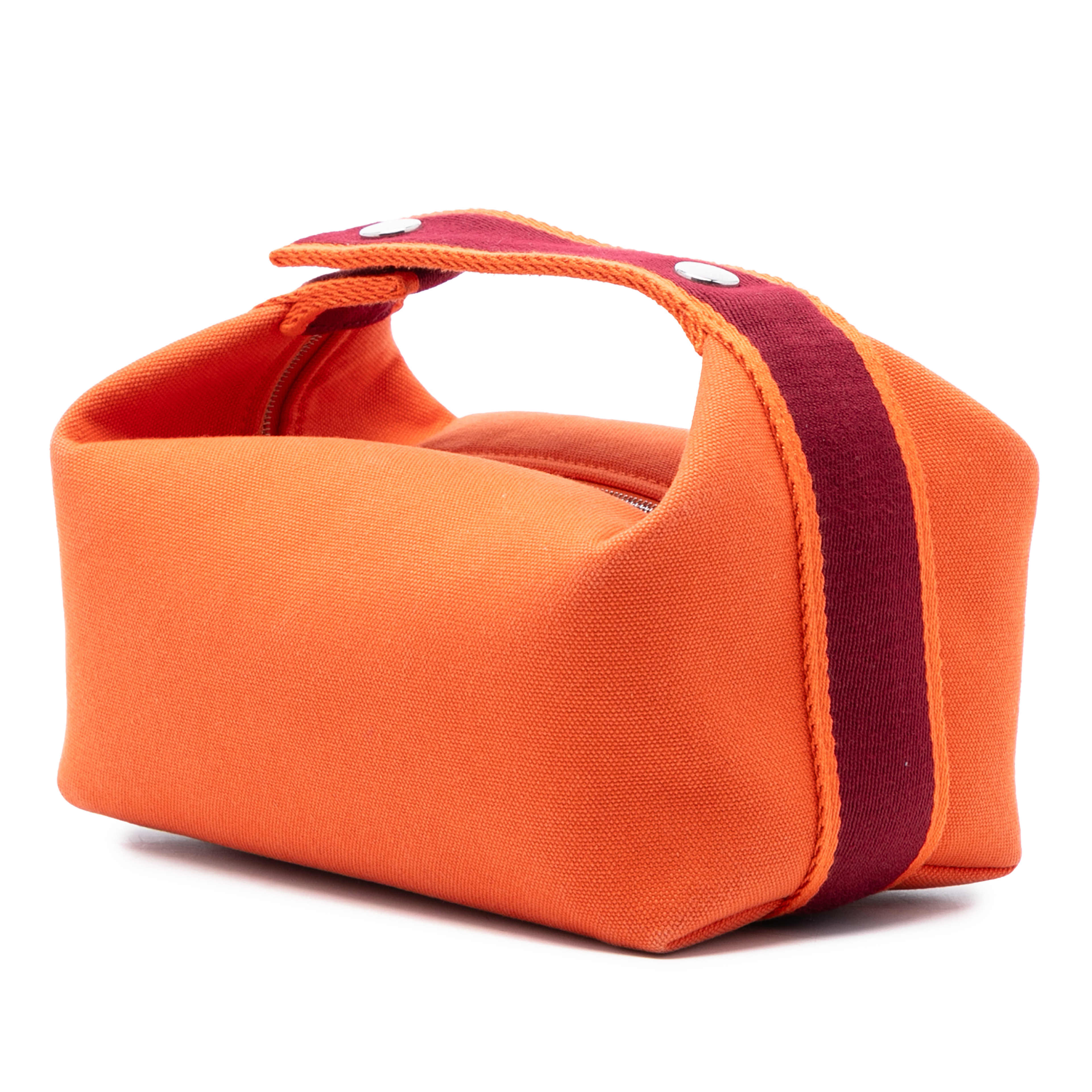 Hermès Small Toile Bride A Brac Case, från Luxclusif, i färgen dark orange. Klicka för att öppna bilden i stort format