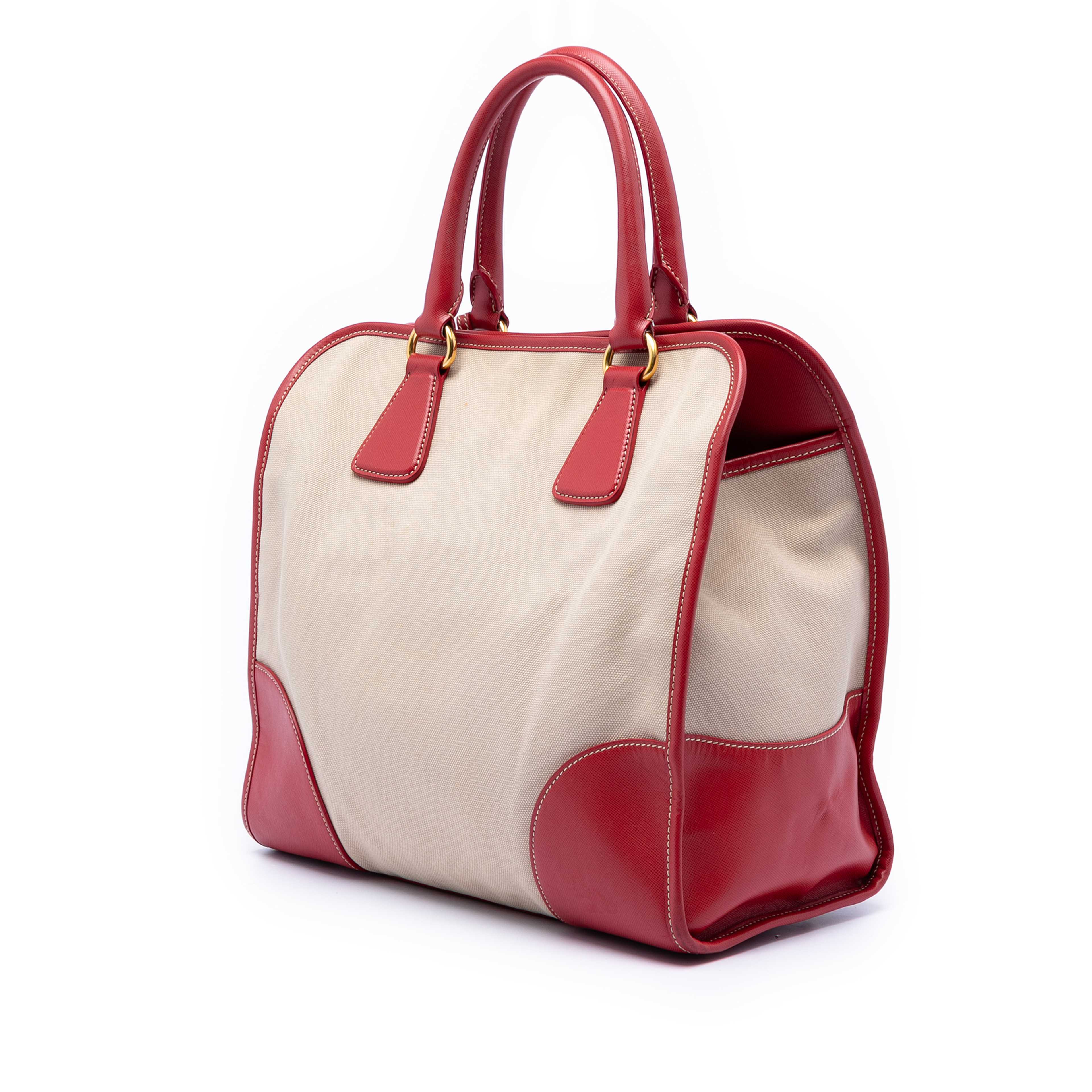 Prada Saffiano Trimmed Canvas Canapa Satchel, från Luxclusif, i färgen beige. Klicka för att öppna bilden i stort format