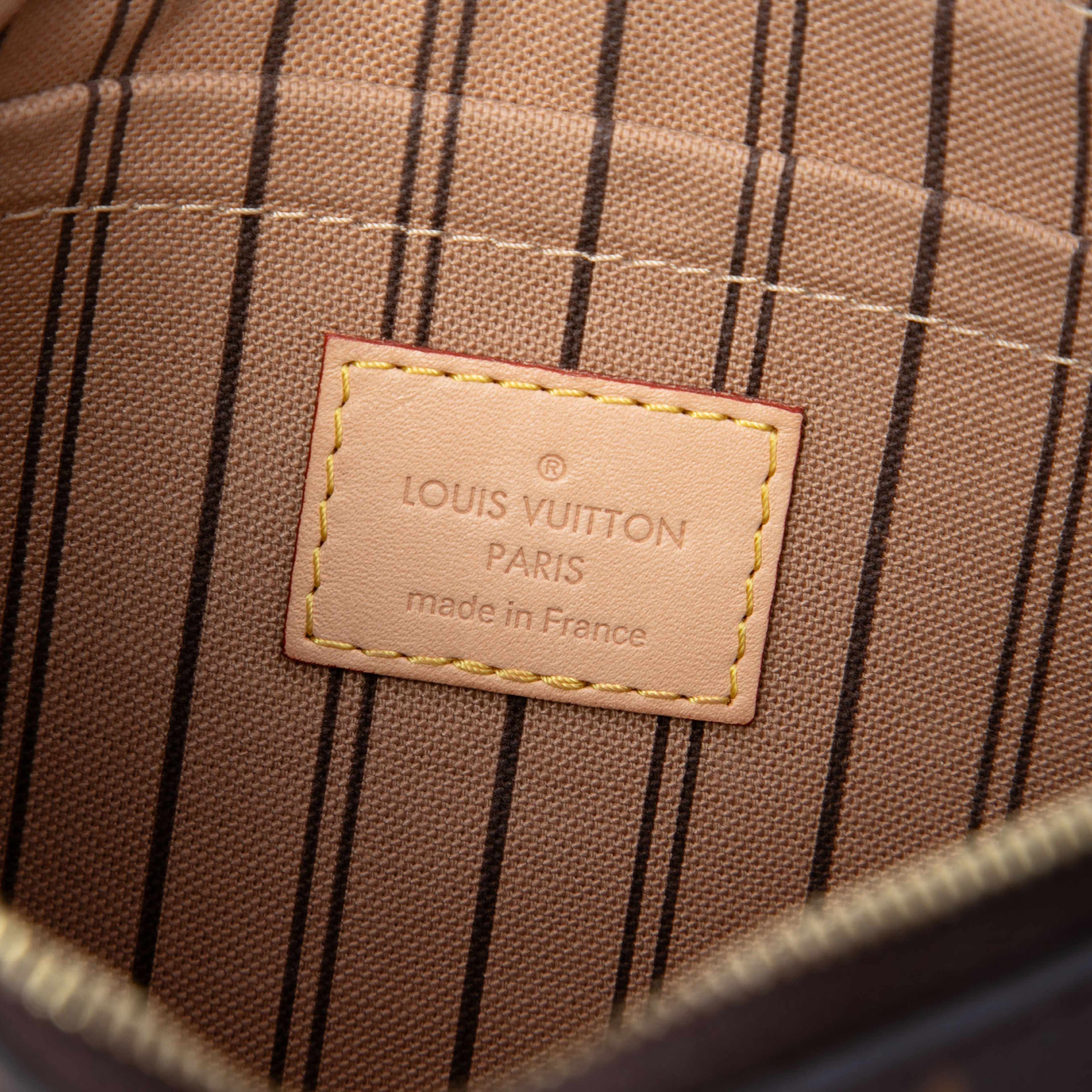 Louis Vuitton Monogram Neverfull Pouch Mm, från Luxclusif, i färgen brun. Klicka för att öppna bilden i stort format