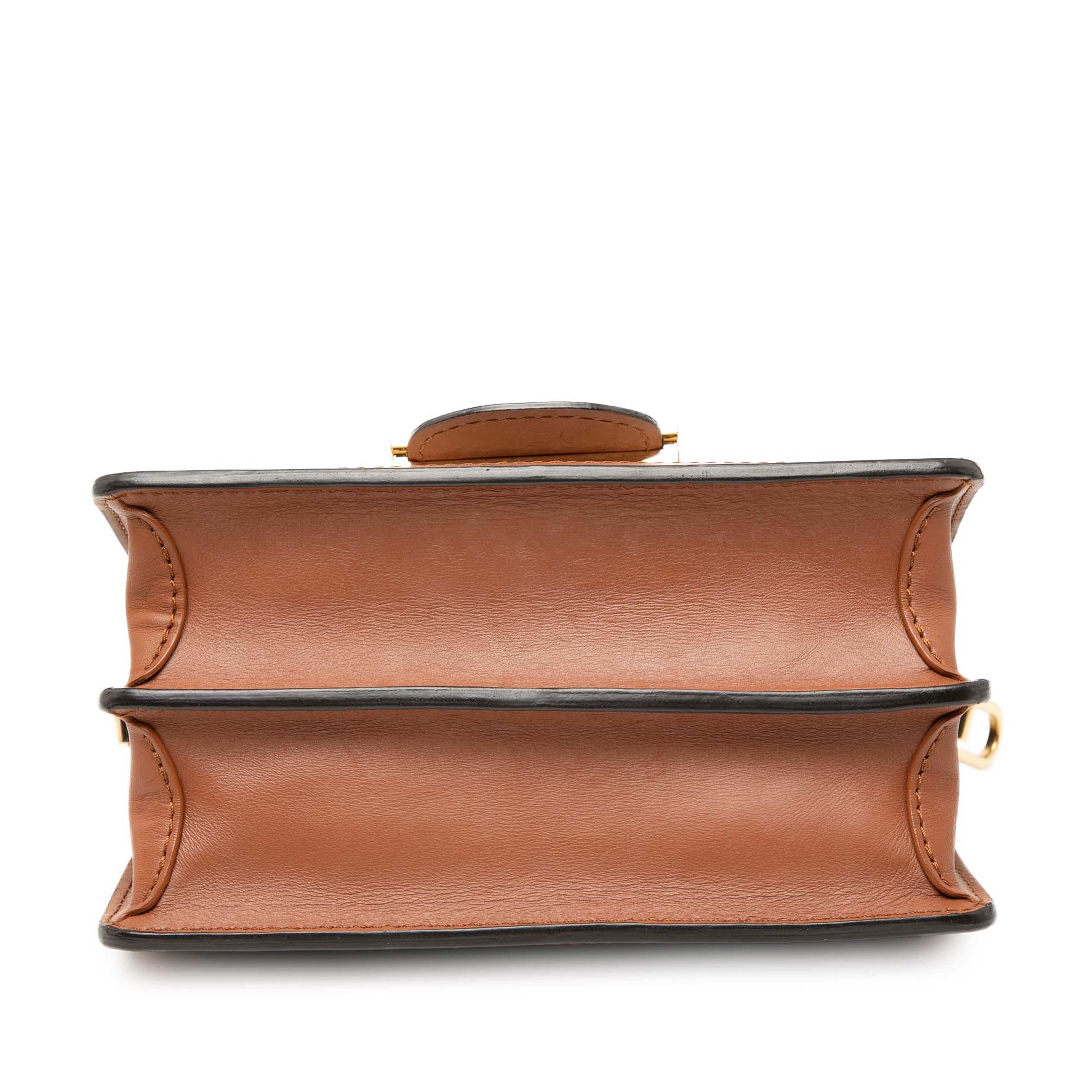 Louis Vuitton Taurillon Mini Dauphine, från Luxclusif, i färgen black. Klicka för att öppna bilden i stort format