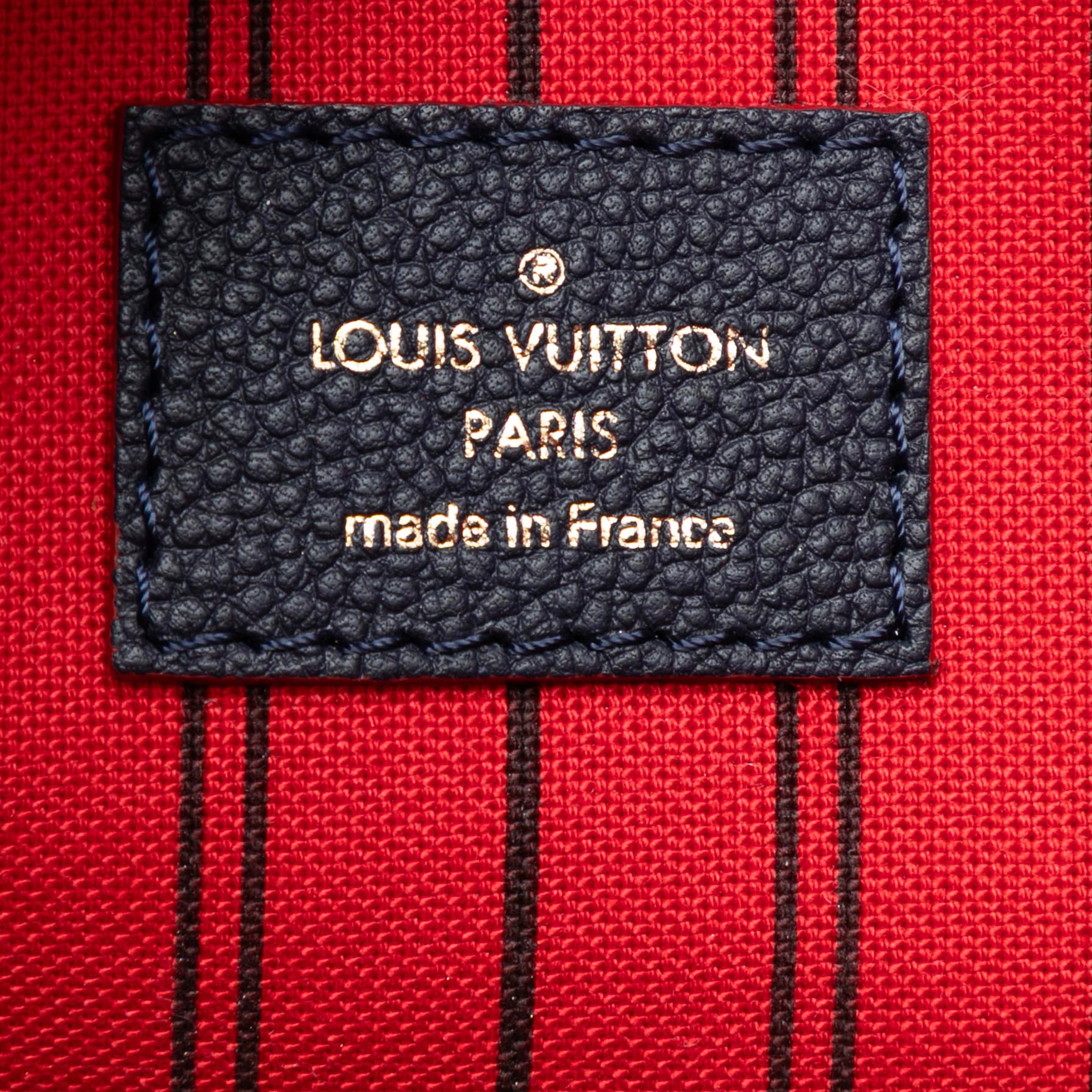 Louis Vuitton Monogram Empreinte Pochette Metis, från Luxclusif, i färgen navy. Klicka för att öppna bilden i stort format