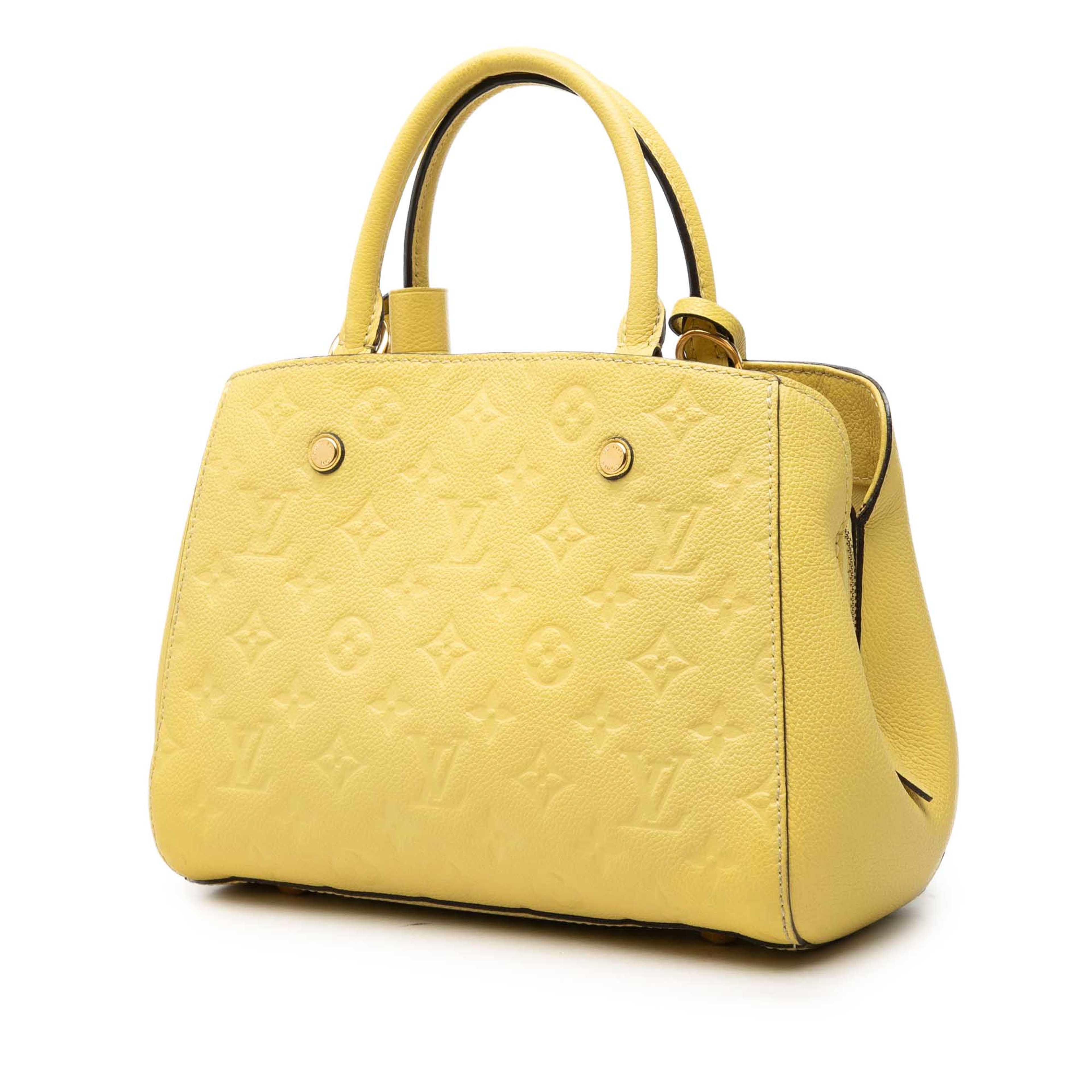 Louis Vuitton Monogram Empreinte Montaigne Bb, från Luxclusif, i färgen gul. Klicka för att öppna bilden i stort format