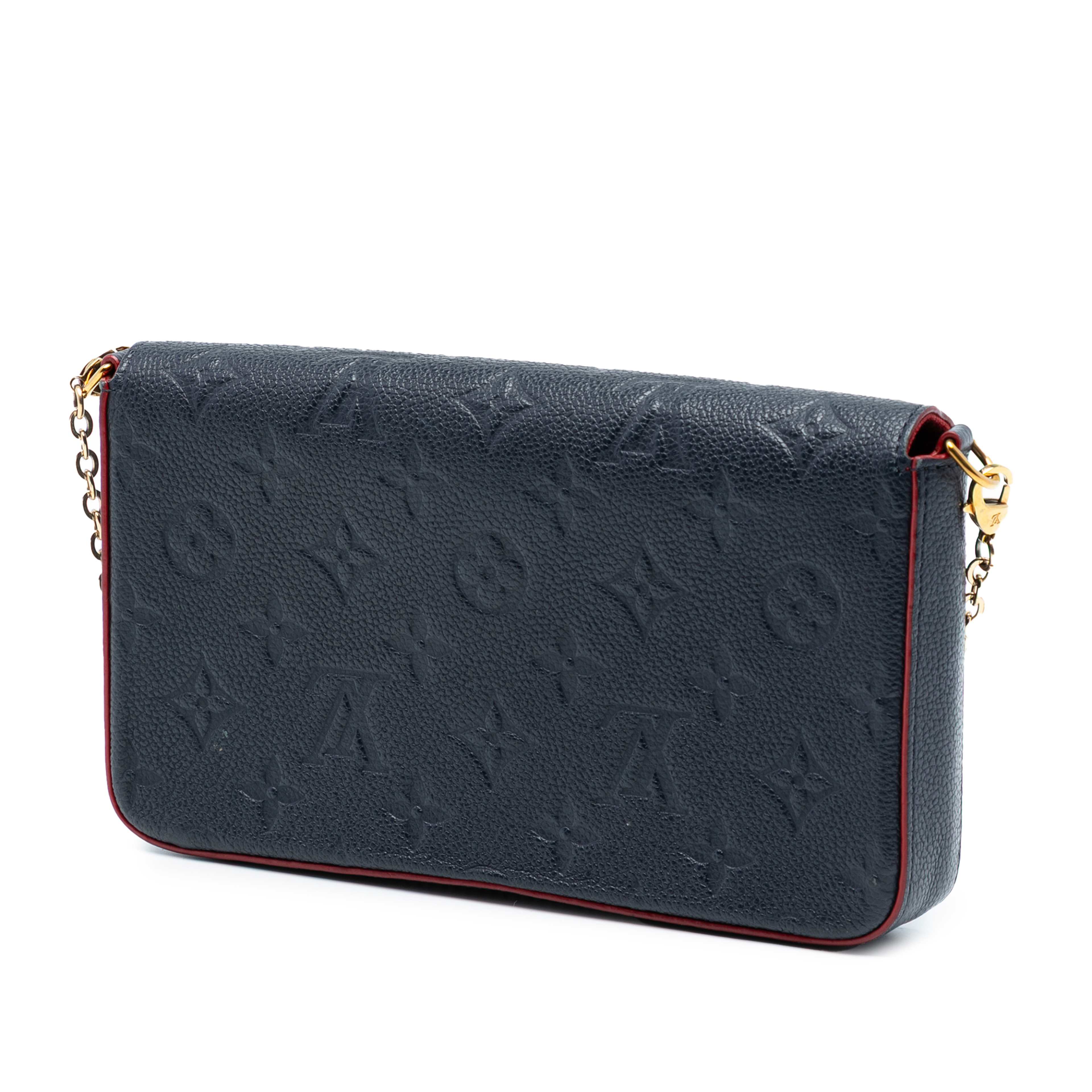 Louis Vuitton Monogram Empreinte Pochette Felicie, från Luxclusif, i färgen navy. Klicka för att öppna bilden i stort format