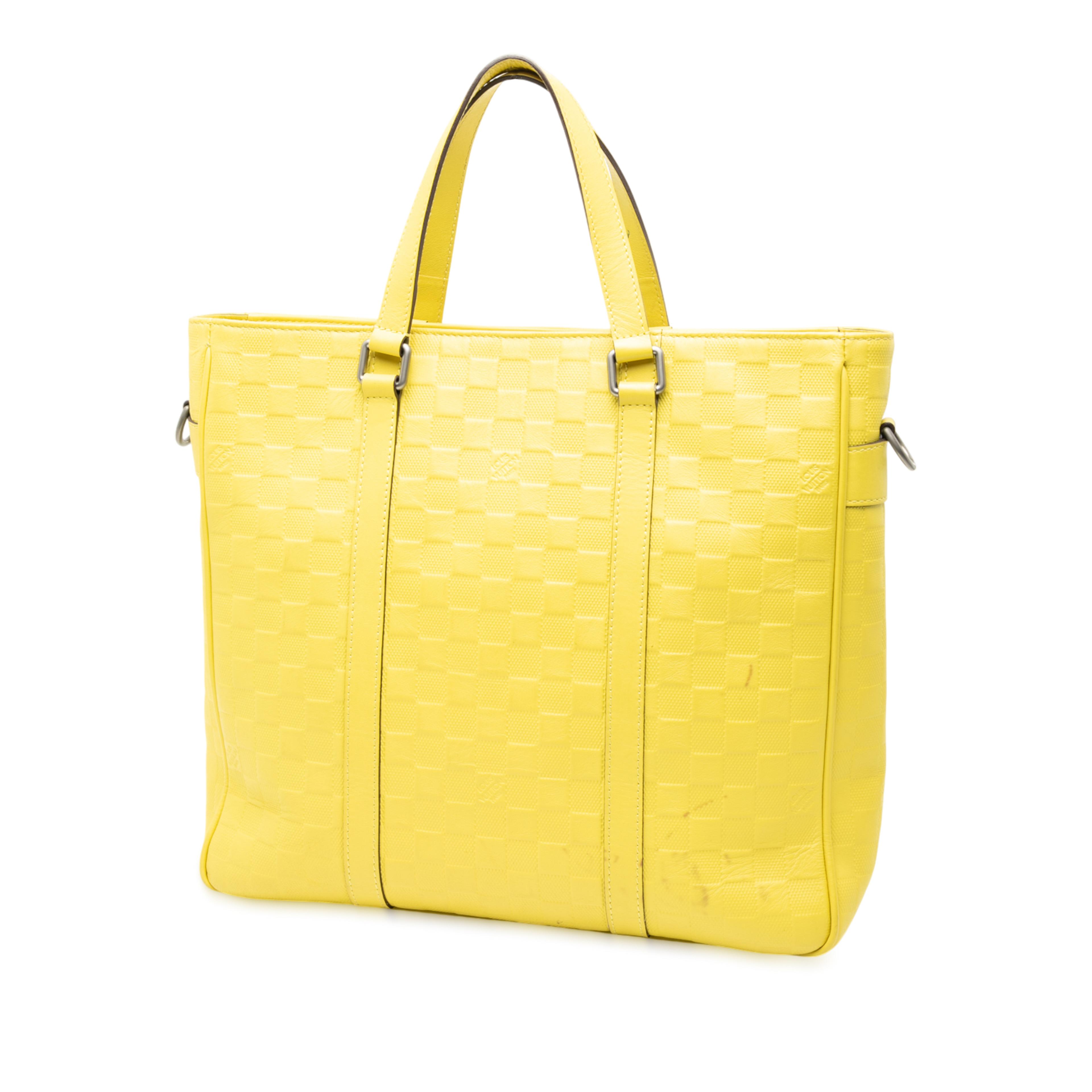 Louis Vuitton Damier Infini Tadao, från Luxclusif, i färgen gul. Klicka för att öppna bilden i stort format