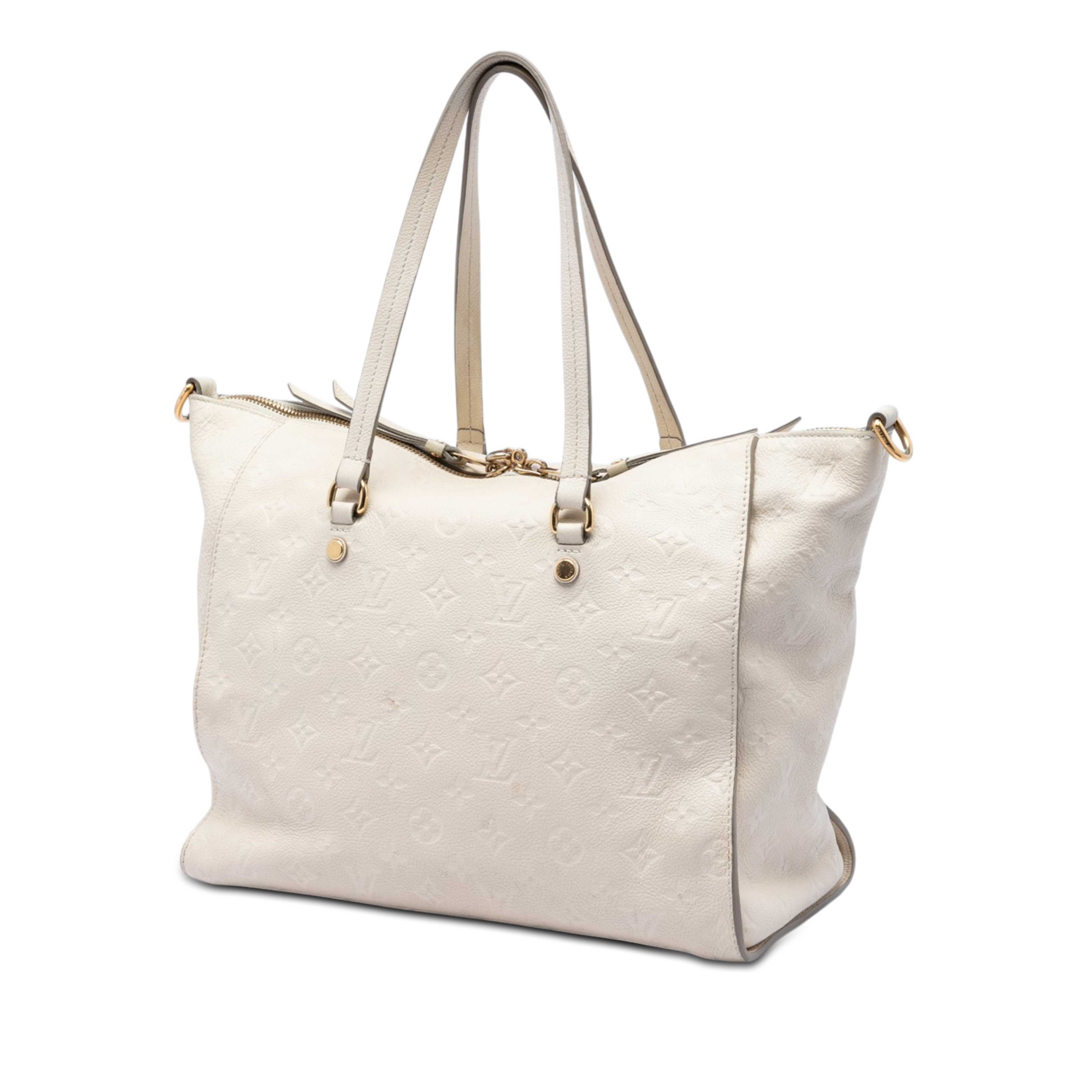 Louis Vuitton Monogram Empreinte Lumineuse Pm, från Luxclusif, i färgen beige. Klicka för att öppna bilden i stort format