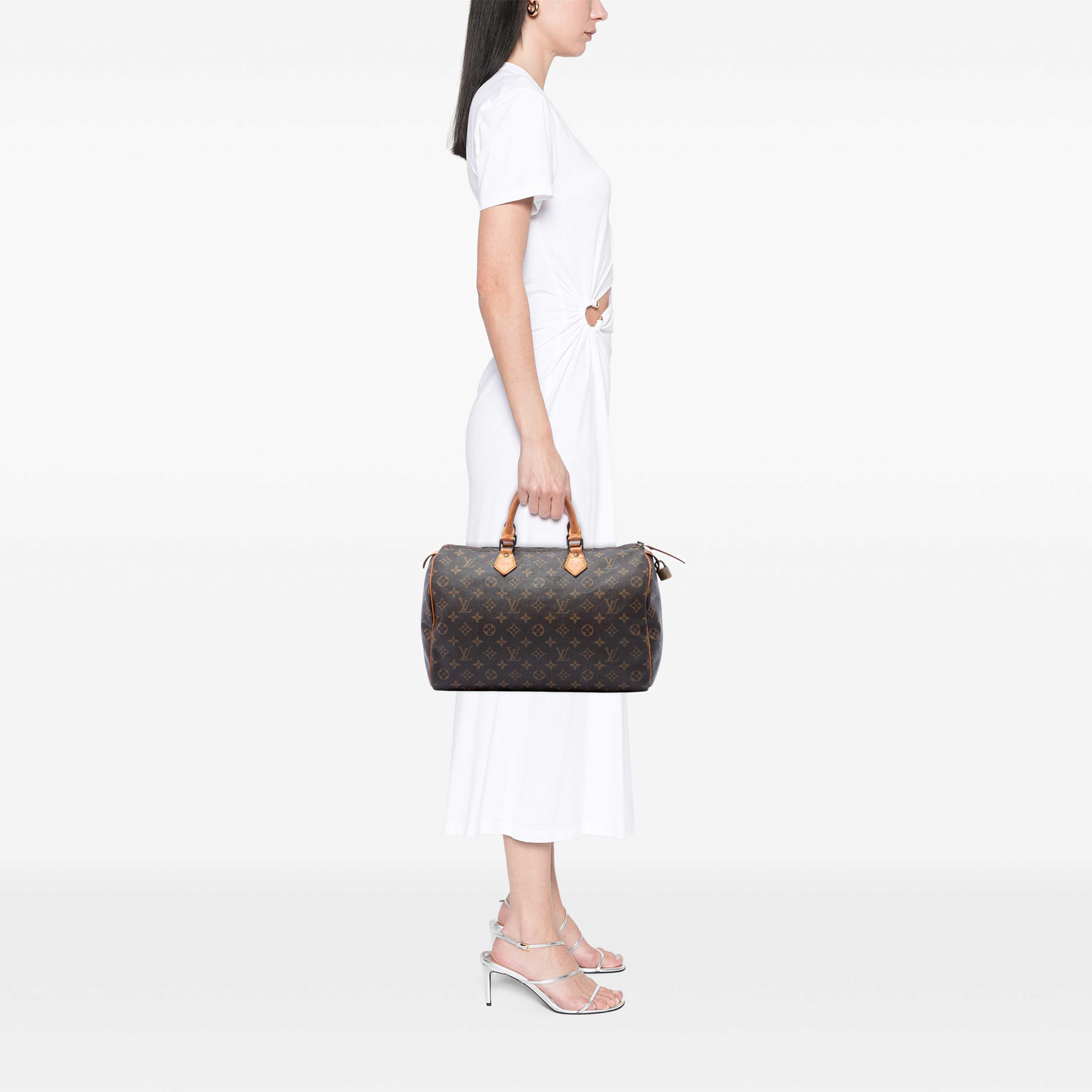 Louis Vuitton Monogram Speedy 35, från Luxclusif, i färgen brun. Klicka för att öppna bilden i stort format