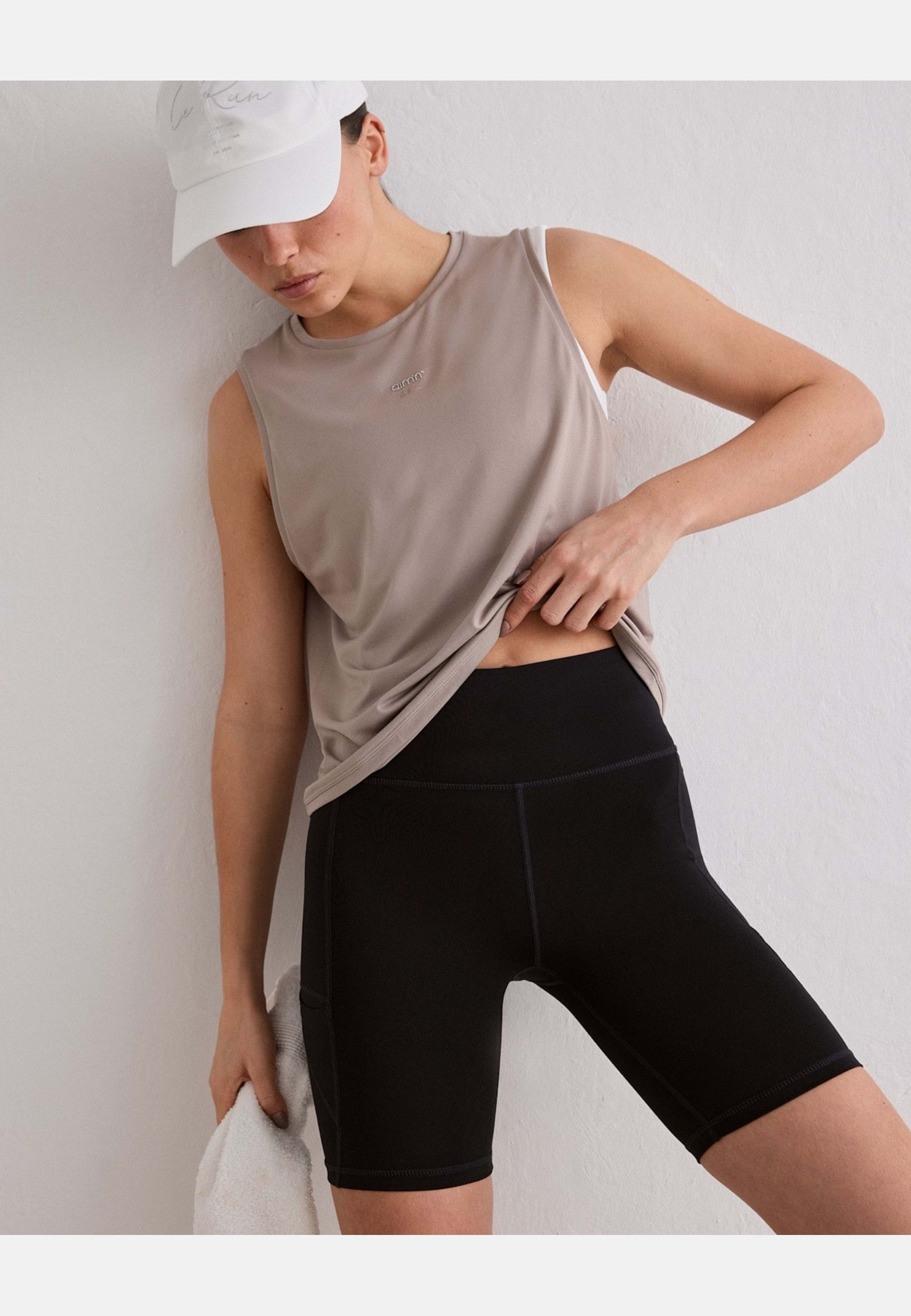 Seamless Running Top, från aim'n, i färgen dark clay. Klicka för att öppna bilden i stort format