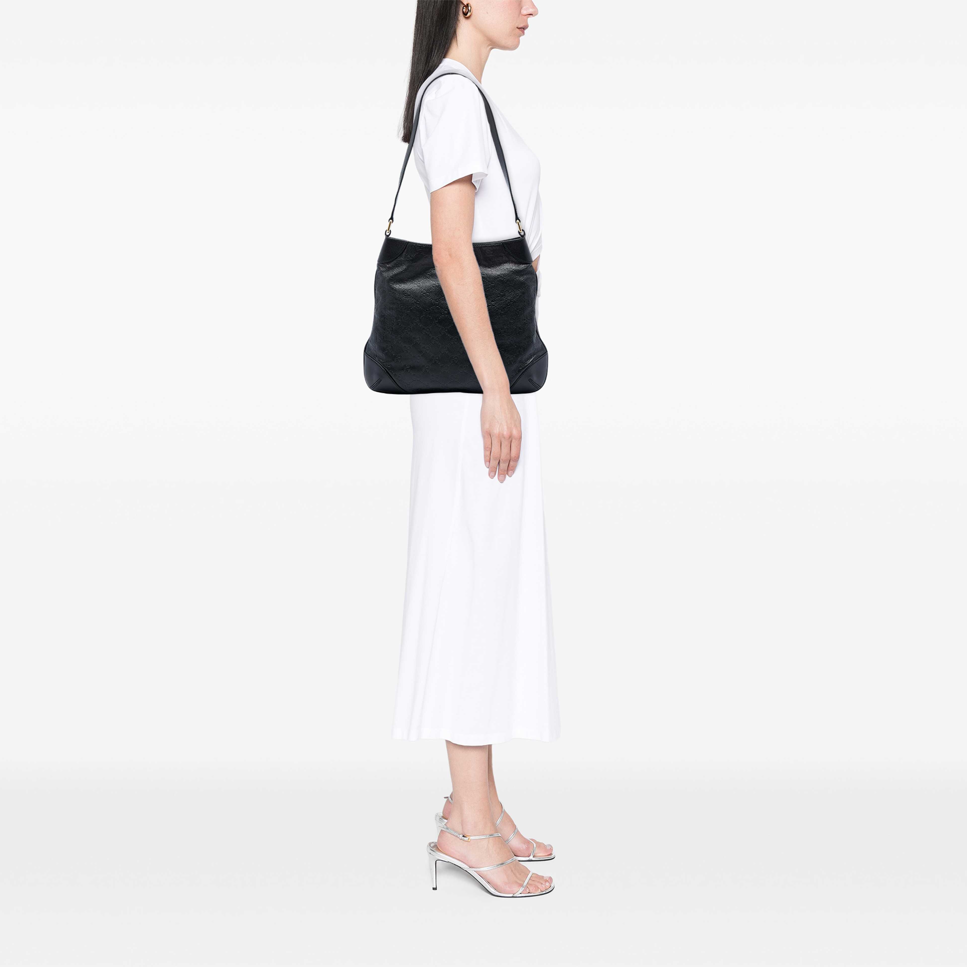 Gucci Guccissima Shoulder Bag, från Luxclusif, i färgen svart. Klicka för att öppna bilden i stort format