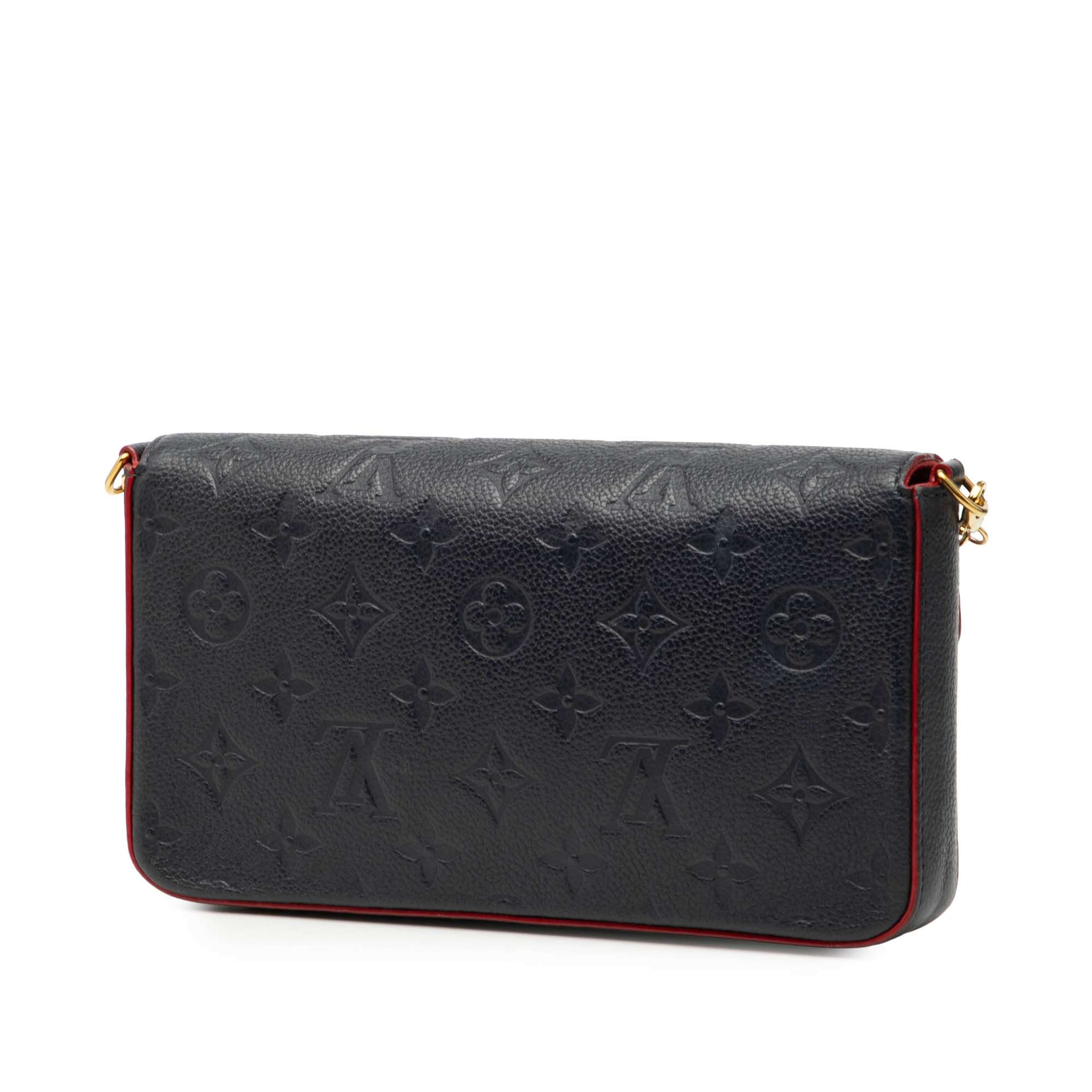 Louis Vuitton Monogram Empreinte Pochette Felicie, från Luxclusif, i färgen navy. Klicka för att öppna bilden i stort format