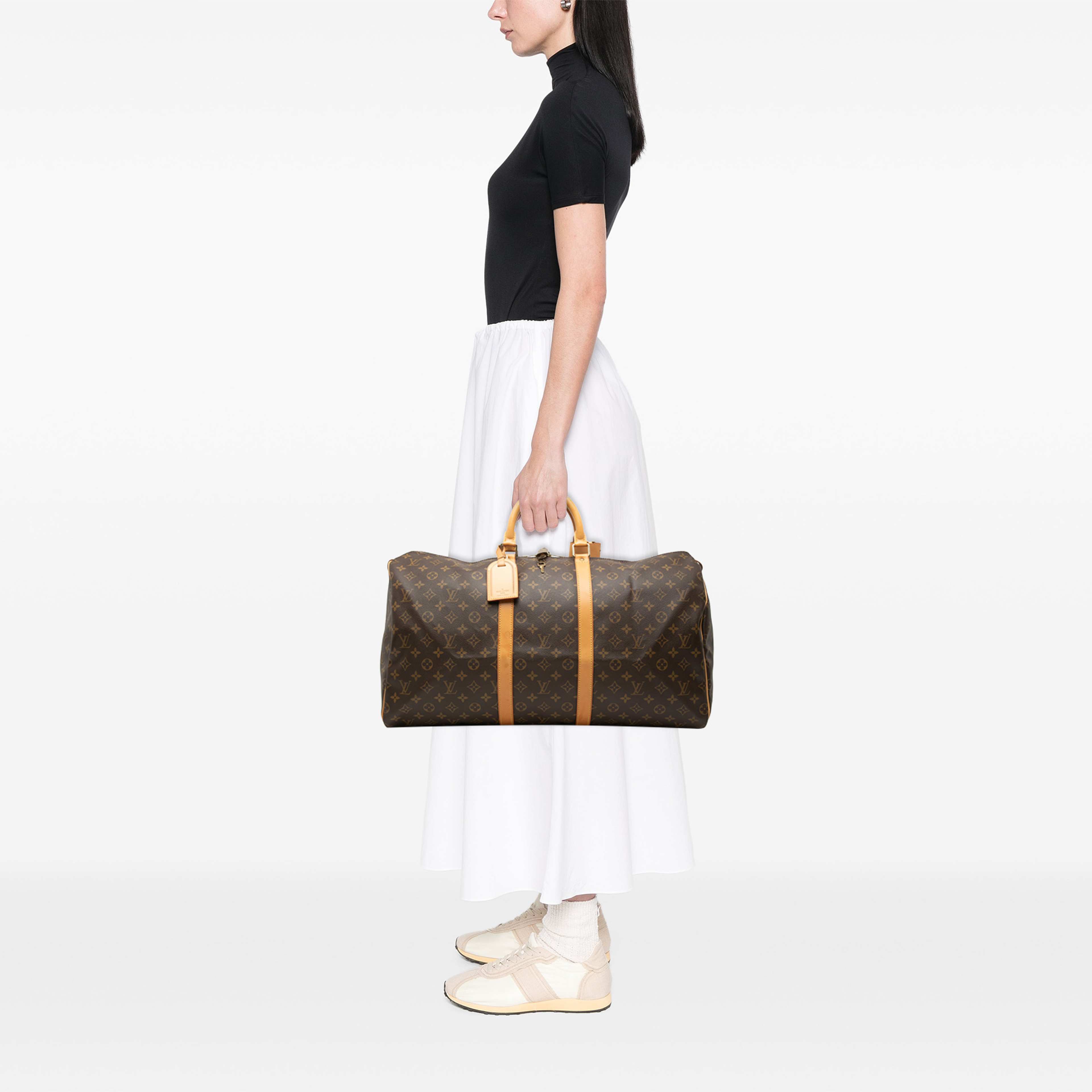 Louis Vuitton Monogram Keepall 55, från Luxclusif, i färgen brun. Klicka för att öppna bilden i stort format