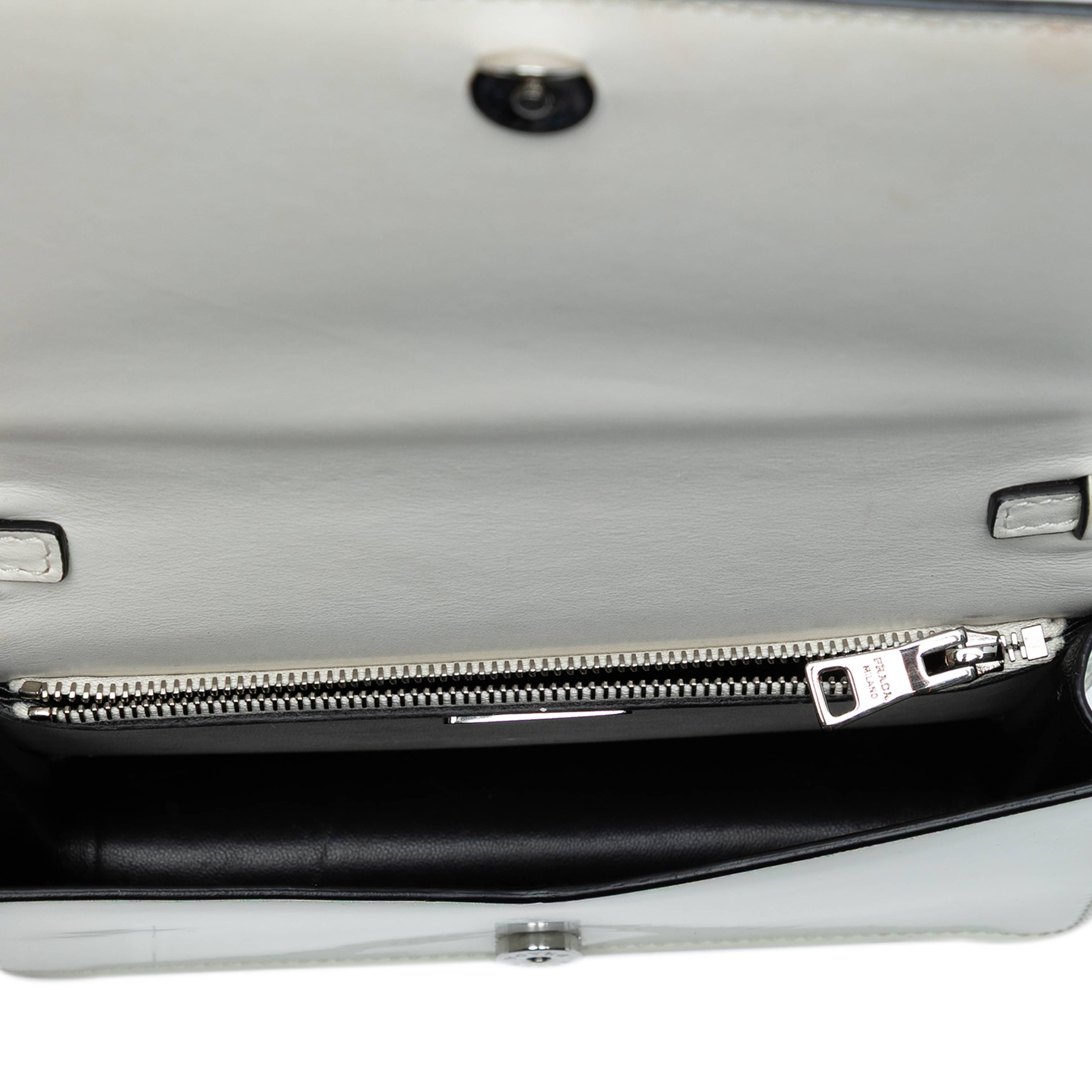 Prada Mini Brushed Leather Chain Crossbody, från Luxclusif, i färgen white. Klicka för att öppna bilden i stort format