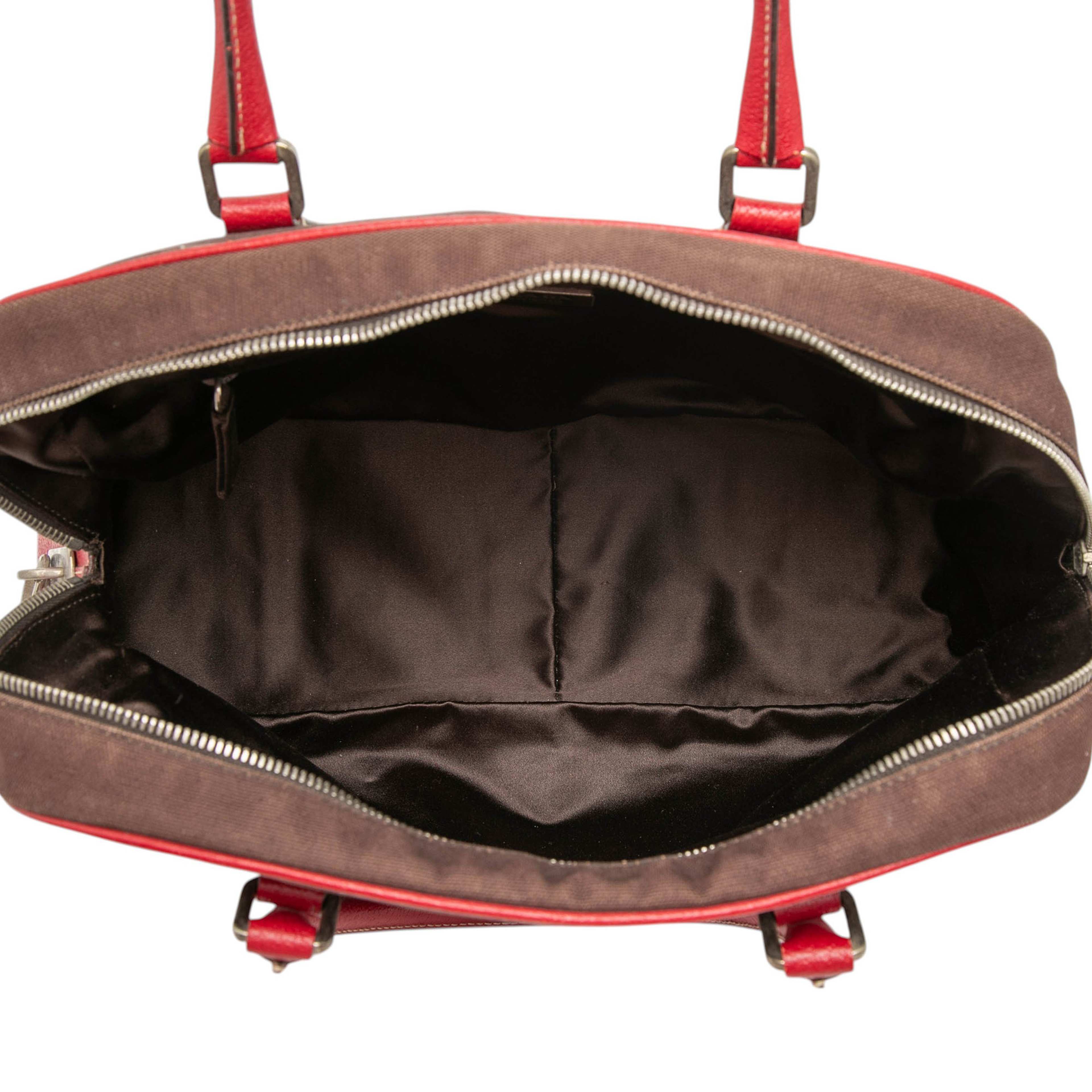 Prada Cinghiale Trimmed Canvas Canapa Bauletto Bag, från Luxclusif, i färgen dark brown. Klicka för att öppna bilden i stort format