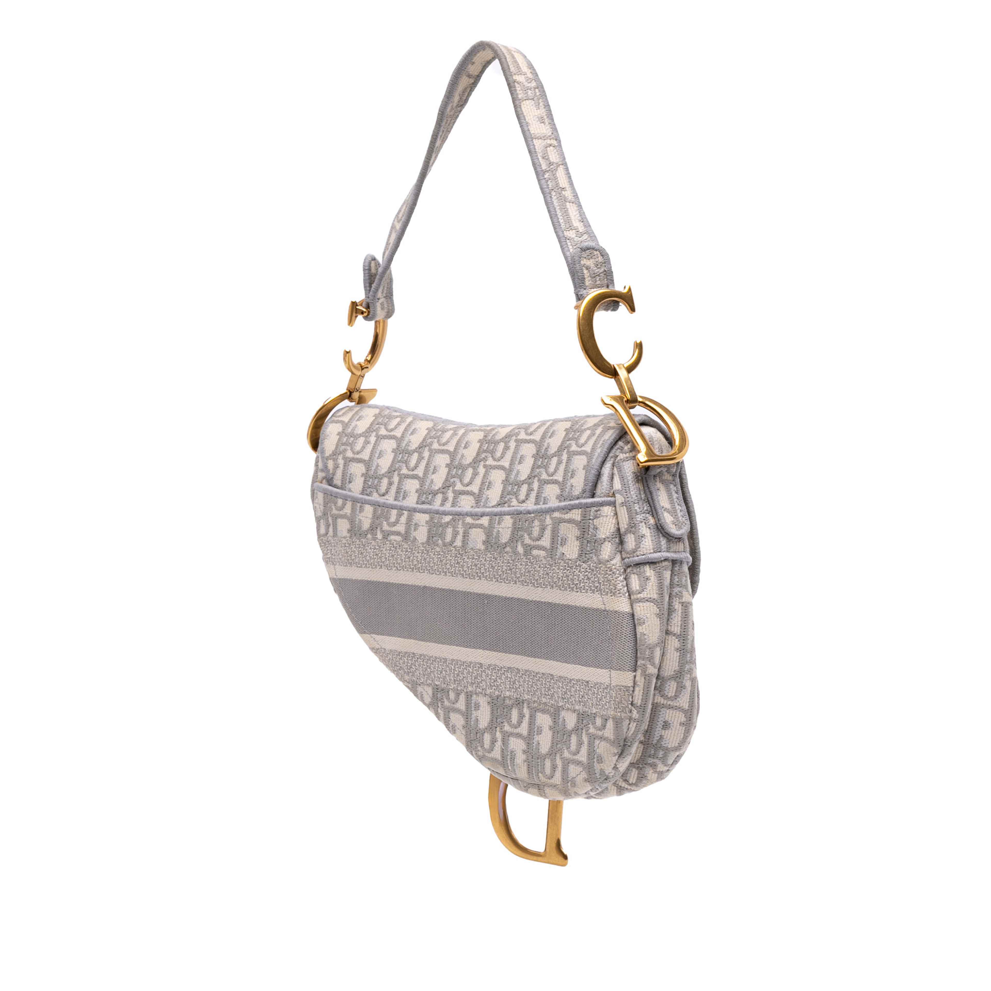 Dior Oblique Canvas Embroidered Saddle Bag, från Luxclusif, i färgen light gray.