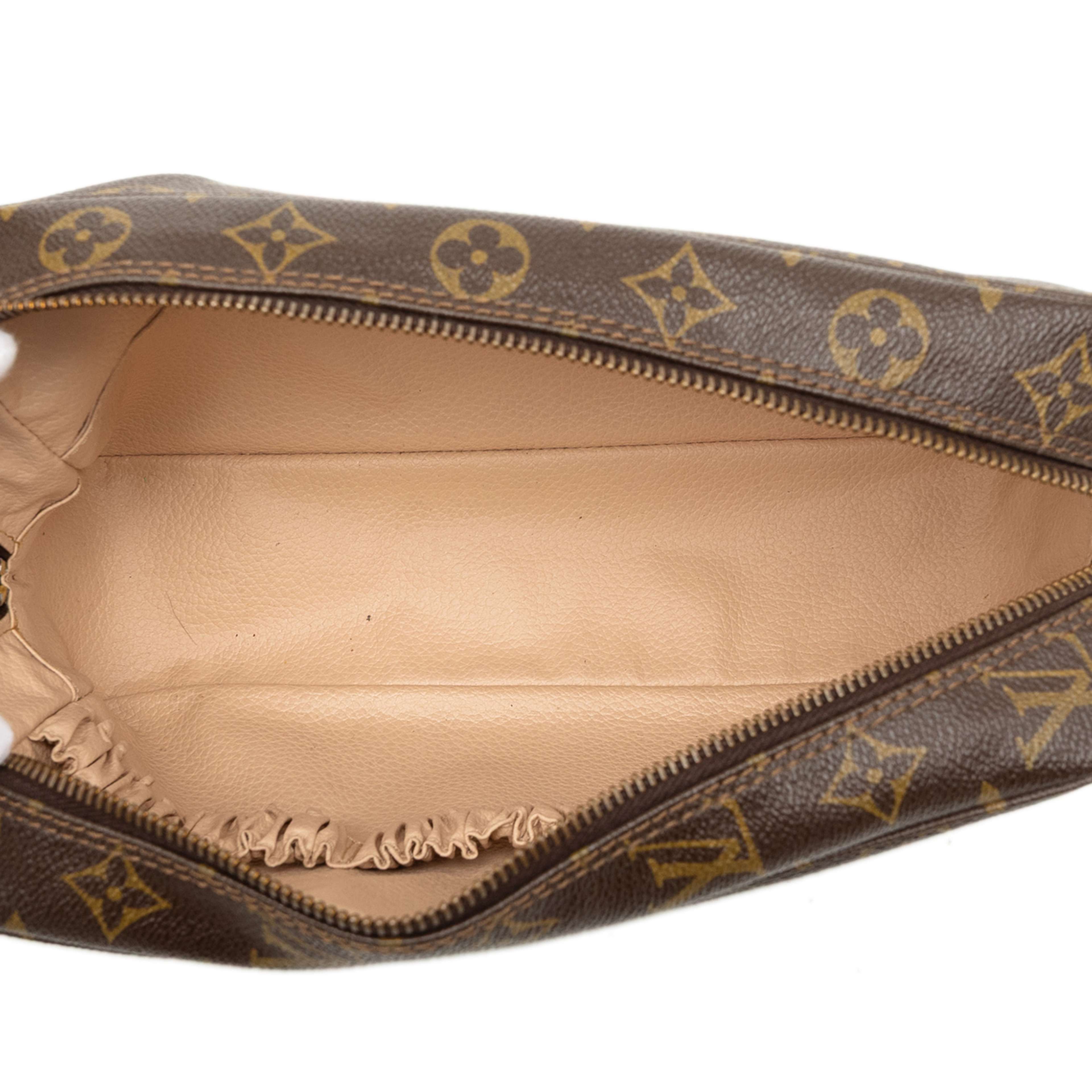 Louis Vuitton Monogram Trousse Toilette 28, från Luxclusif, i färgen brun. Klicka för att öppna bilden i stort format