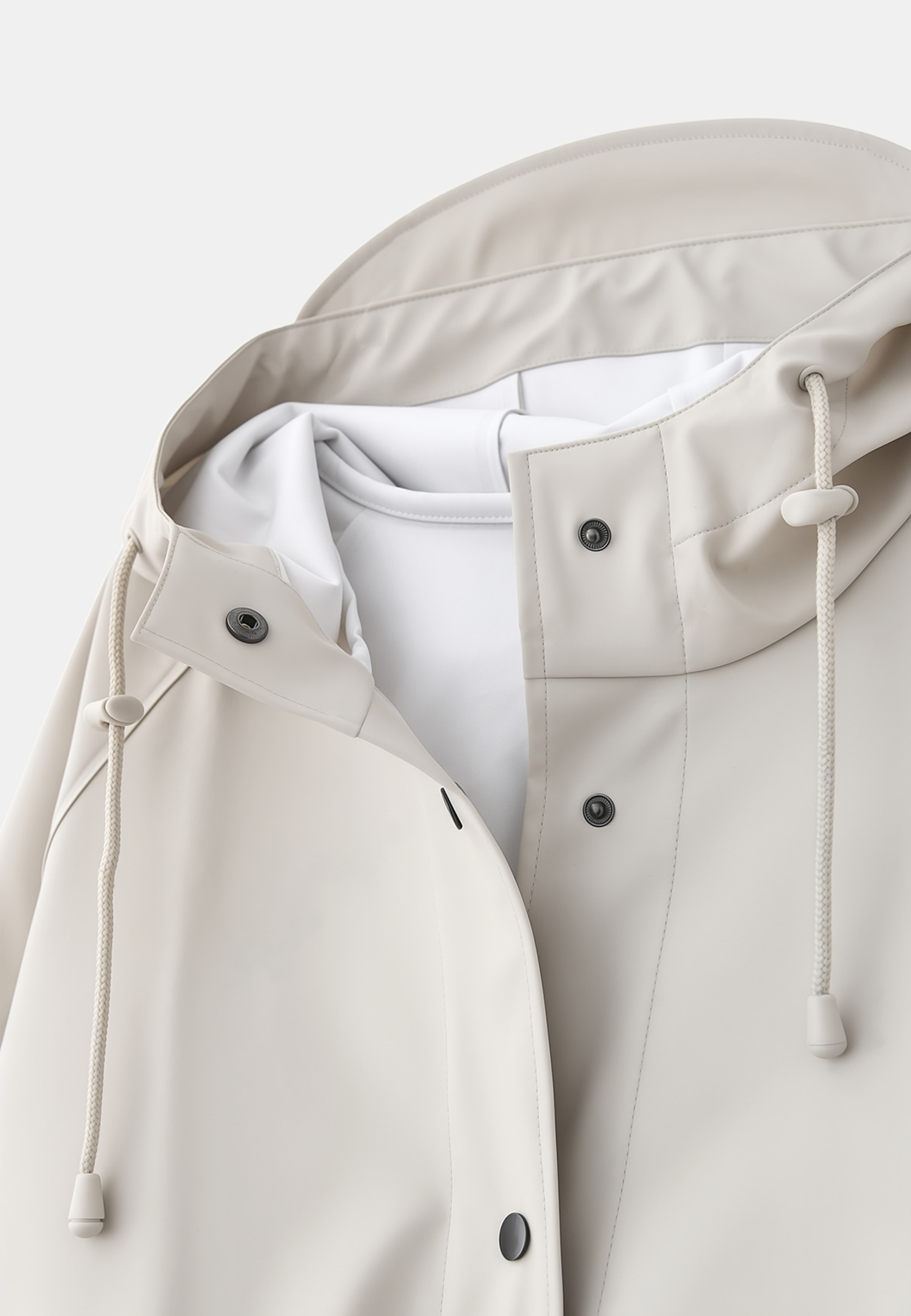 Regnjacka HEAVEN, från Å WOMAN, i färgen Beige. Klicka för att öppna bilden i stort format