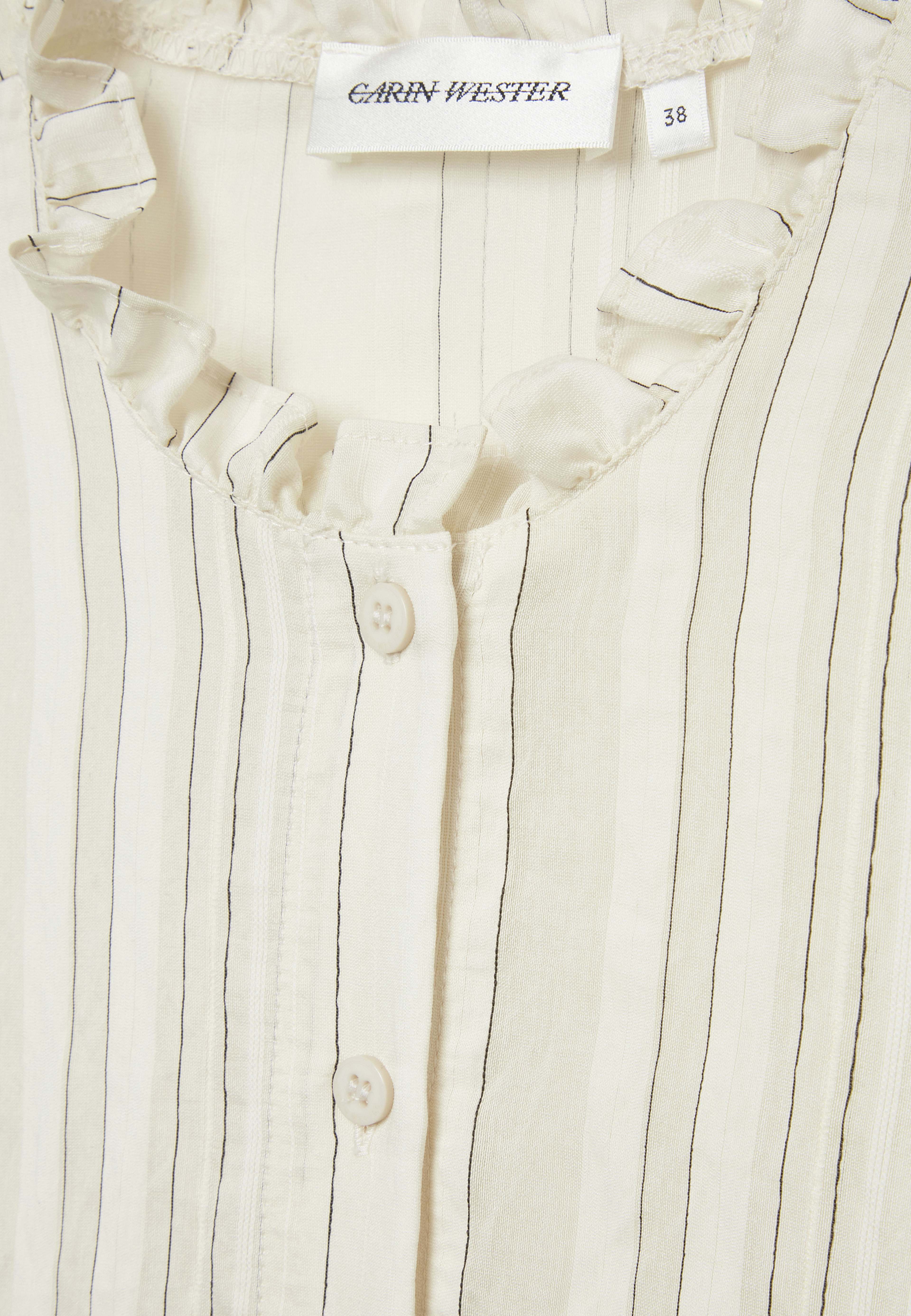 Blus med volang ADNA
