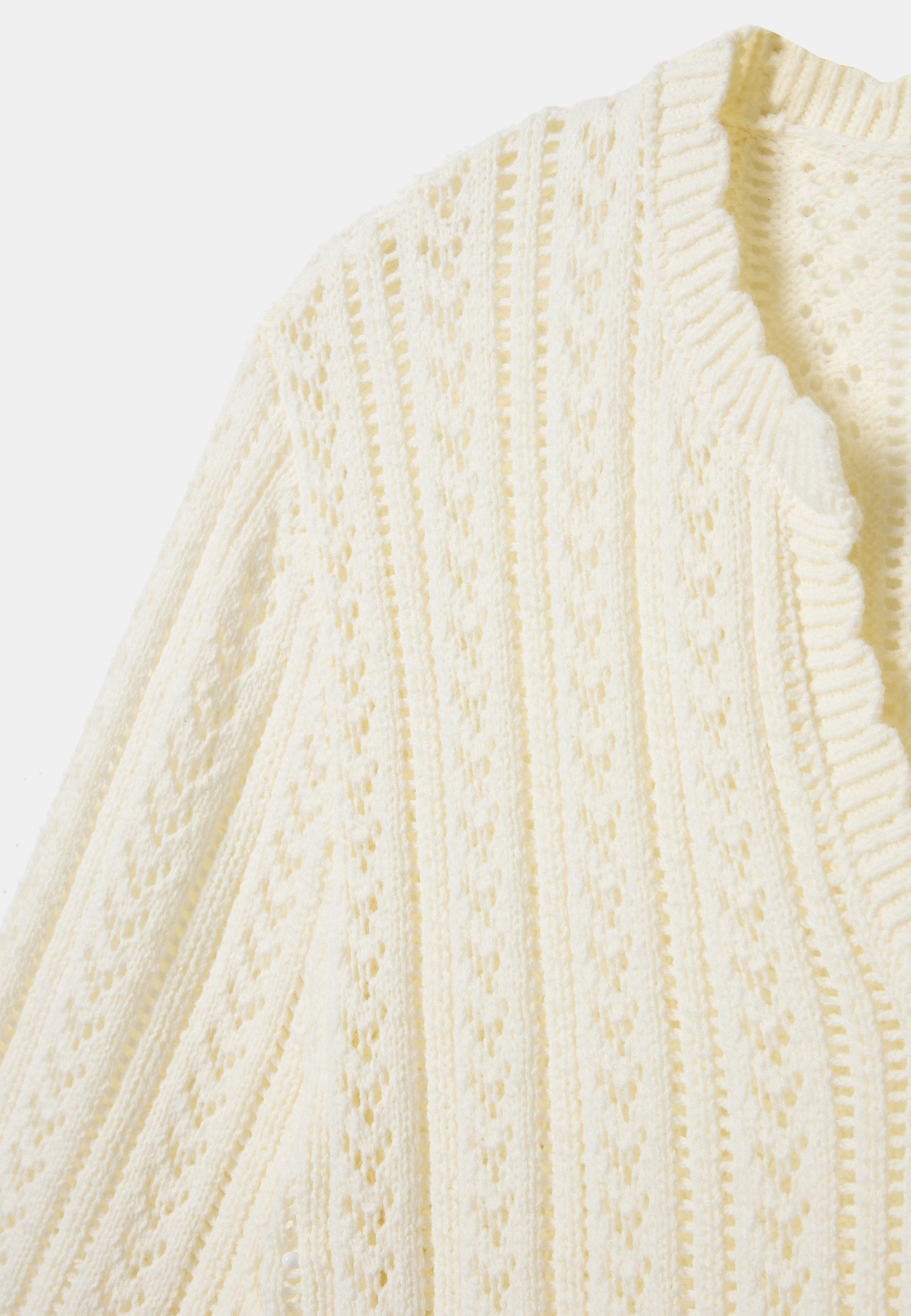 Pointellestickad jumper EMI