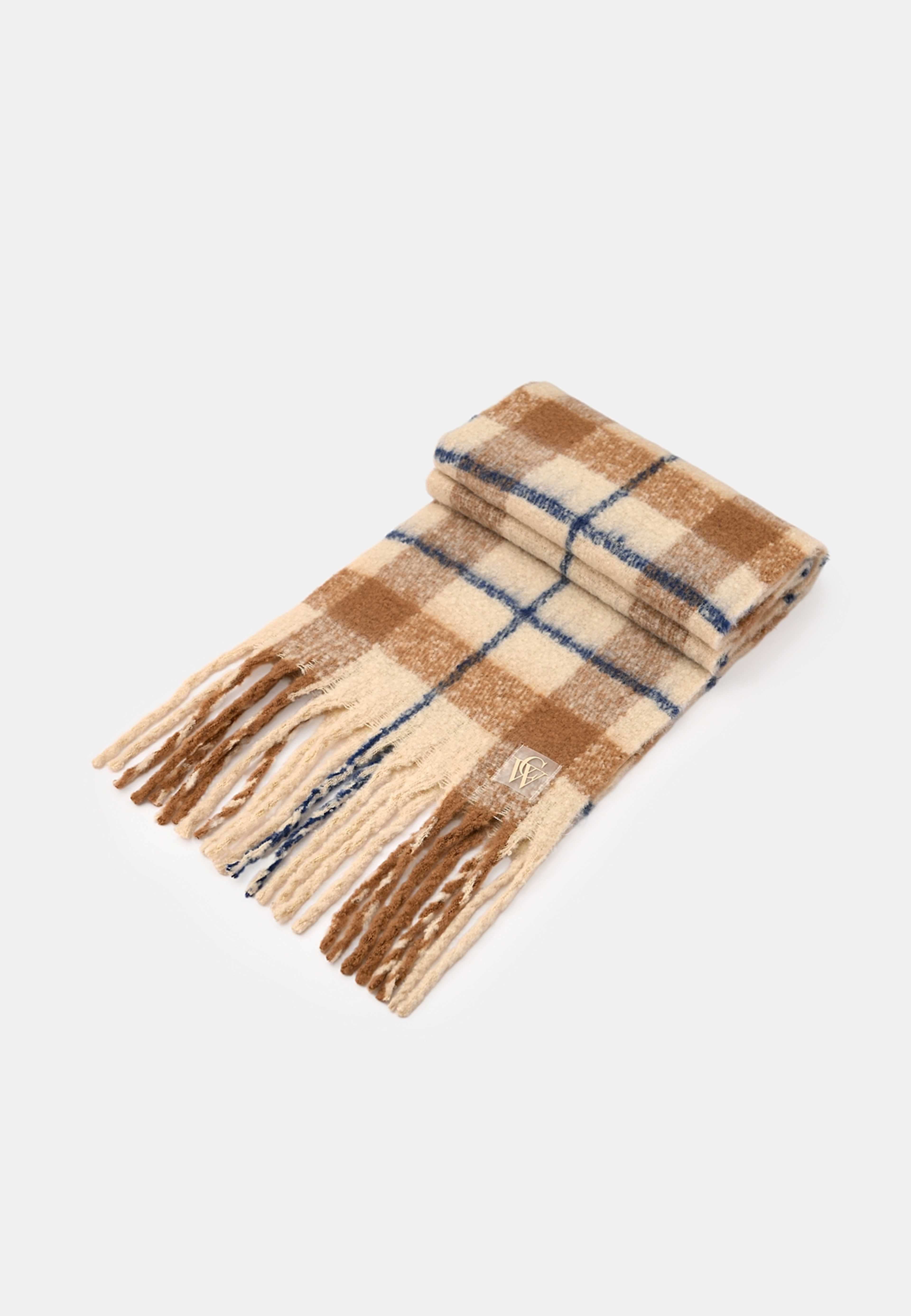 Stickad halsduk med fransar ADA, från Carin Wester, i färgen Blue/Brown. Klicka för att öppna bilden i stort format