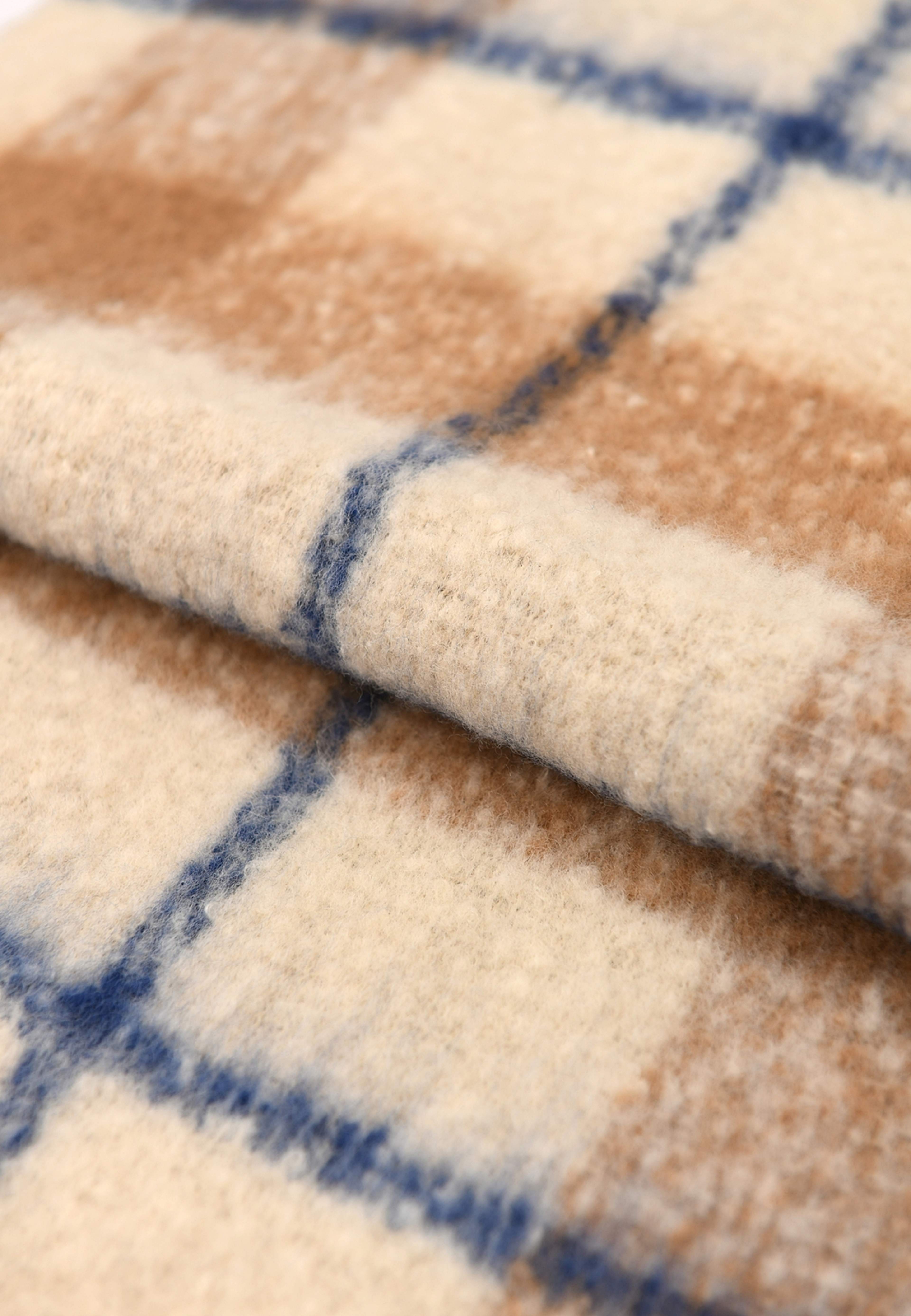 Stickad halsduk med fransar ADA, från Carin Wester, i färgen Blue/Brown. Klicka för att öppna bilden i stort format