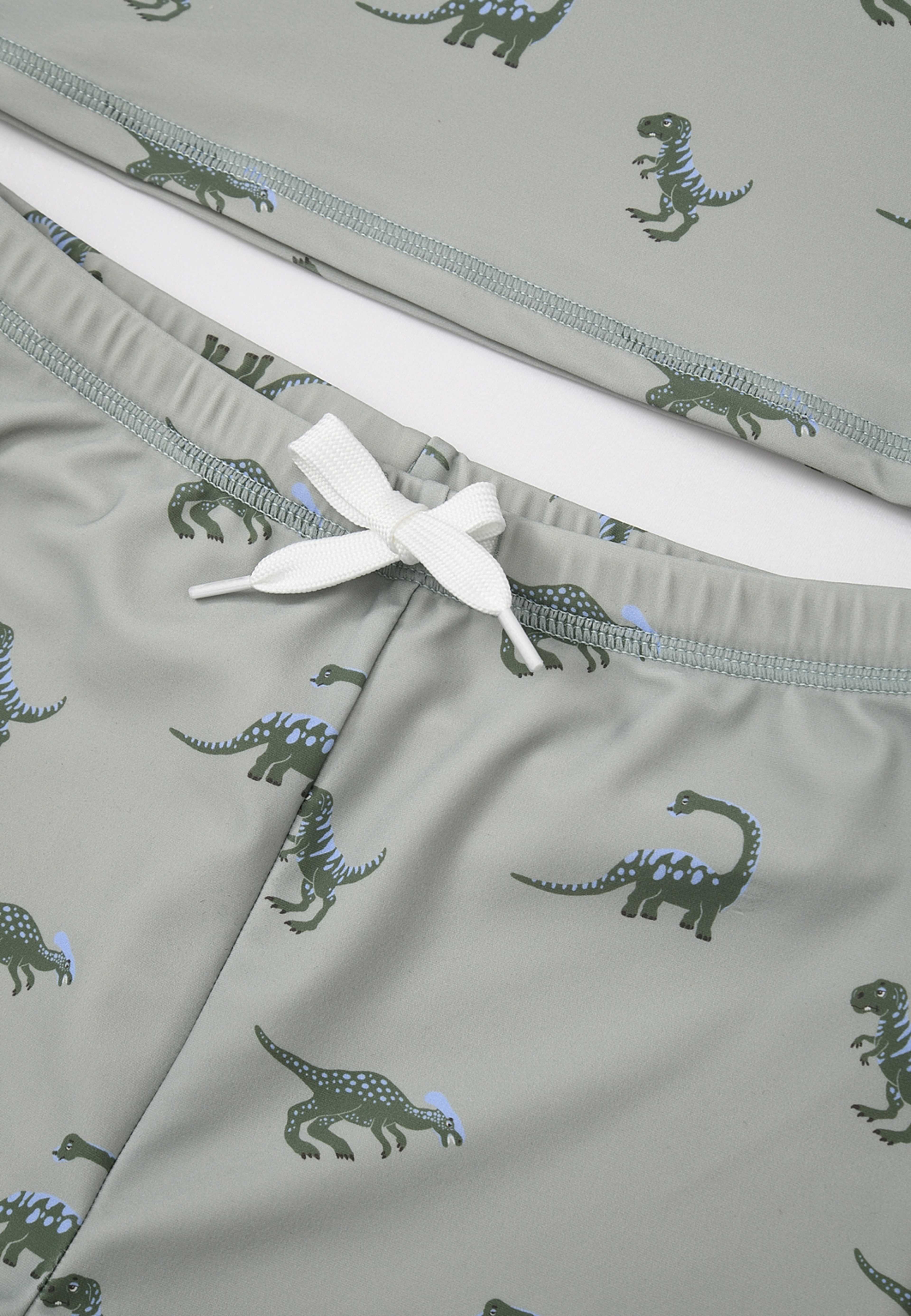 UV-set KERRY, från RIKIKI, i färgen Dino / Green. Klicka för att öppna bilden i stort format