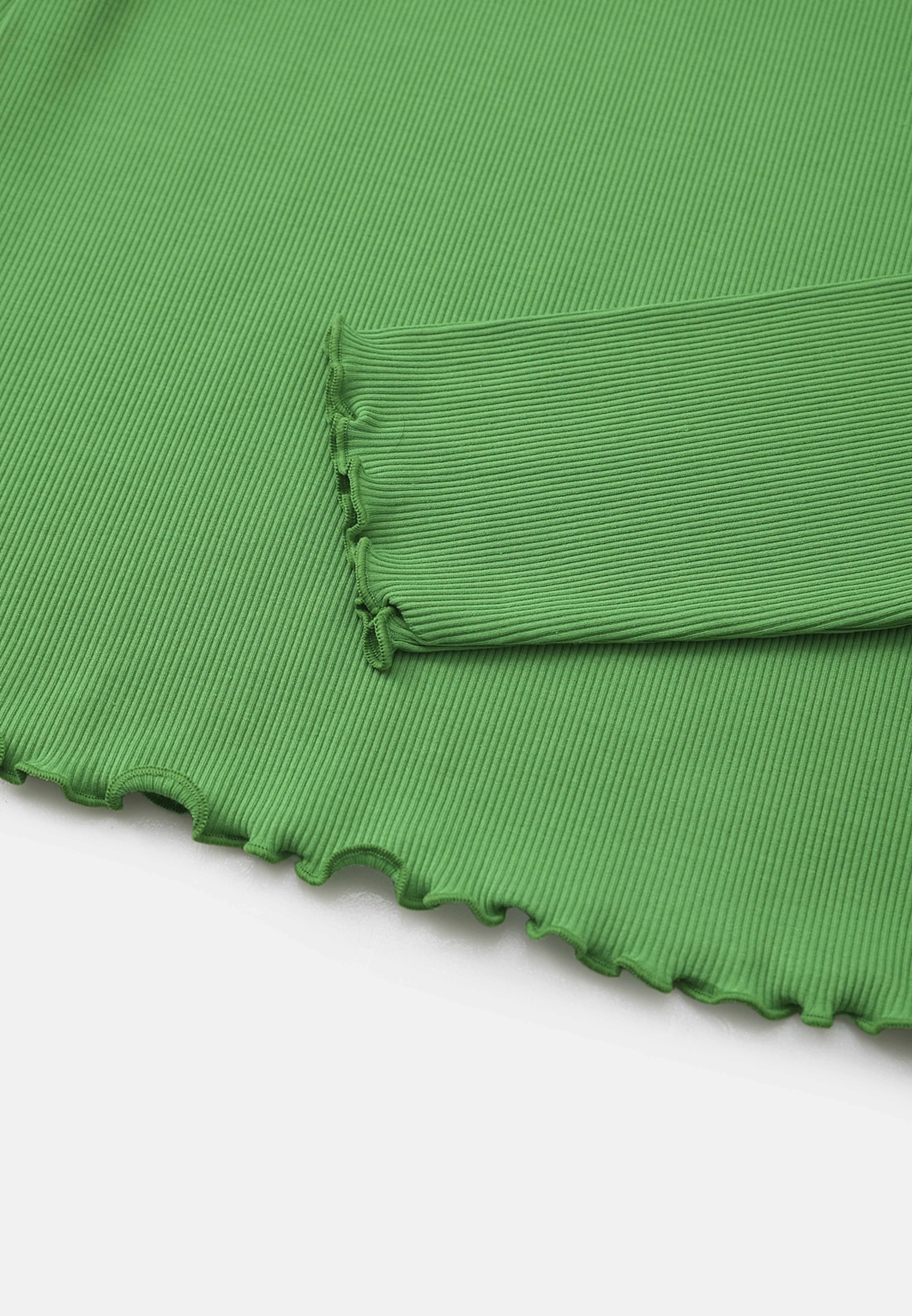 Långärmad topp ISTAR, från Carin Wester, i färgen Bright Green. Klicka för att öppna bilden i stort format