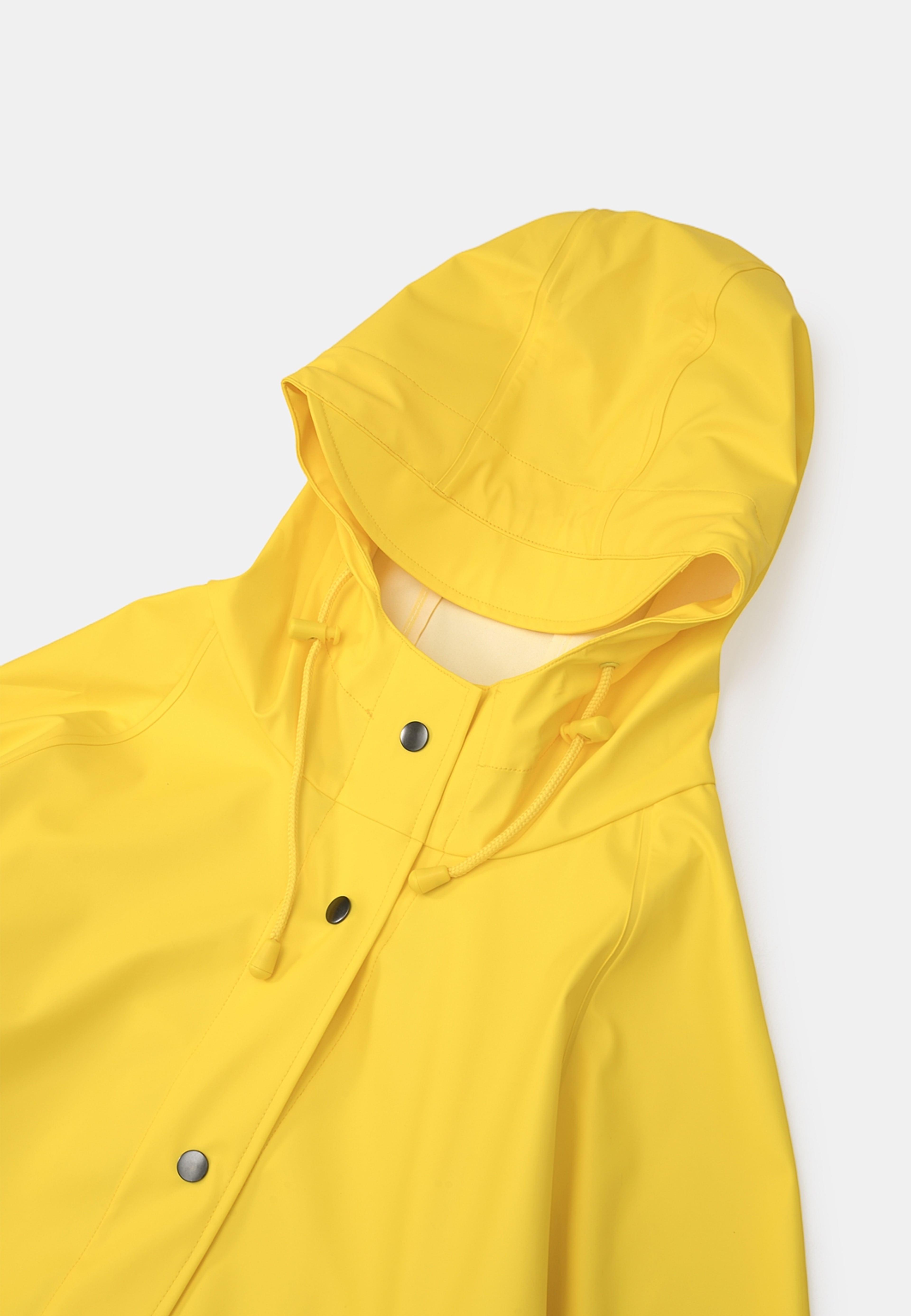 Regnjacka HEAVEN, från Å WOMAN, i färgen Yellow. Klicka för att öppna bilden i stort format