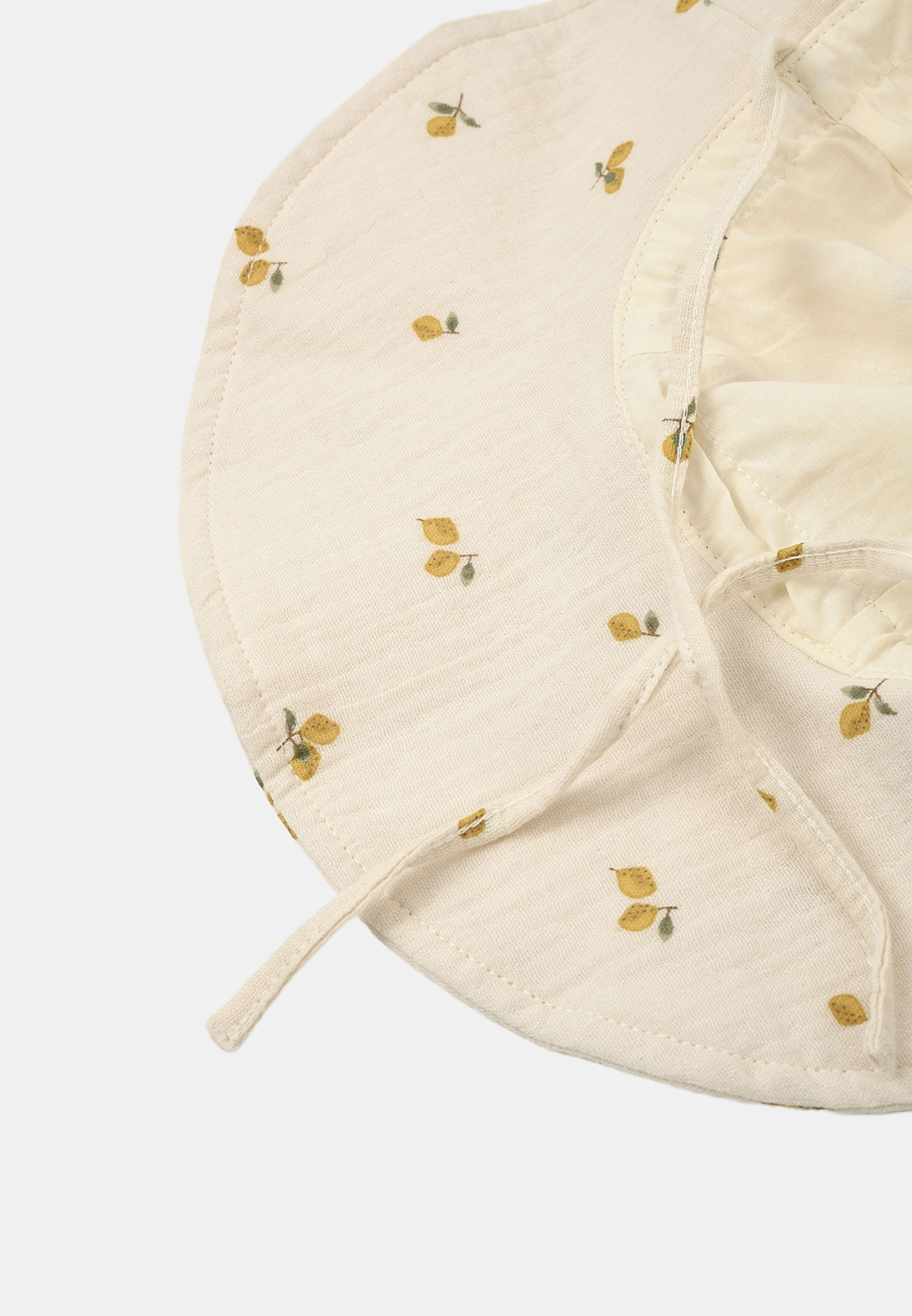 Solhatt i krinklad bomull FRED, från RIKIKI, i färgen Lemon. Klicka för att öppna bilden i stort format