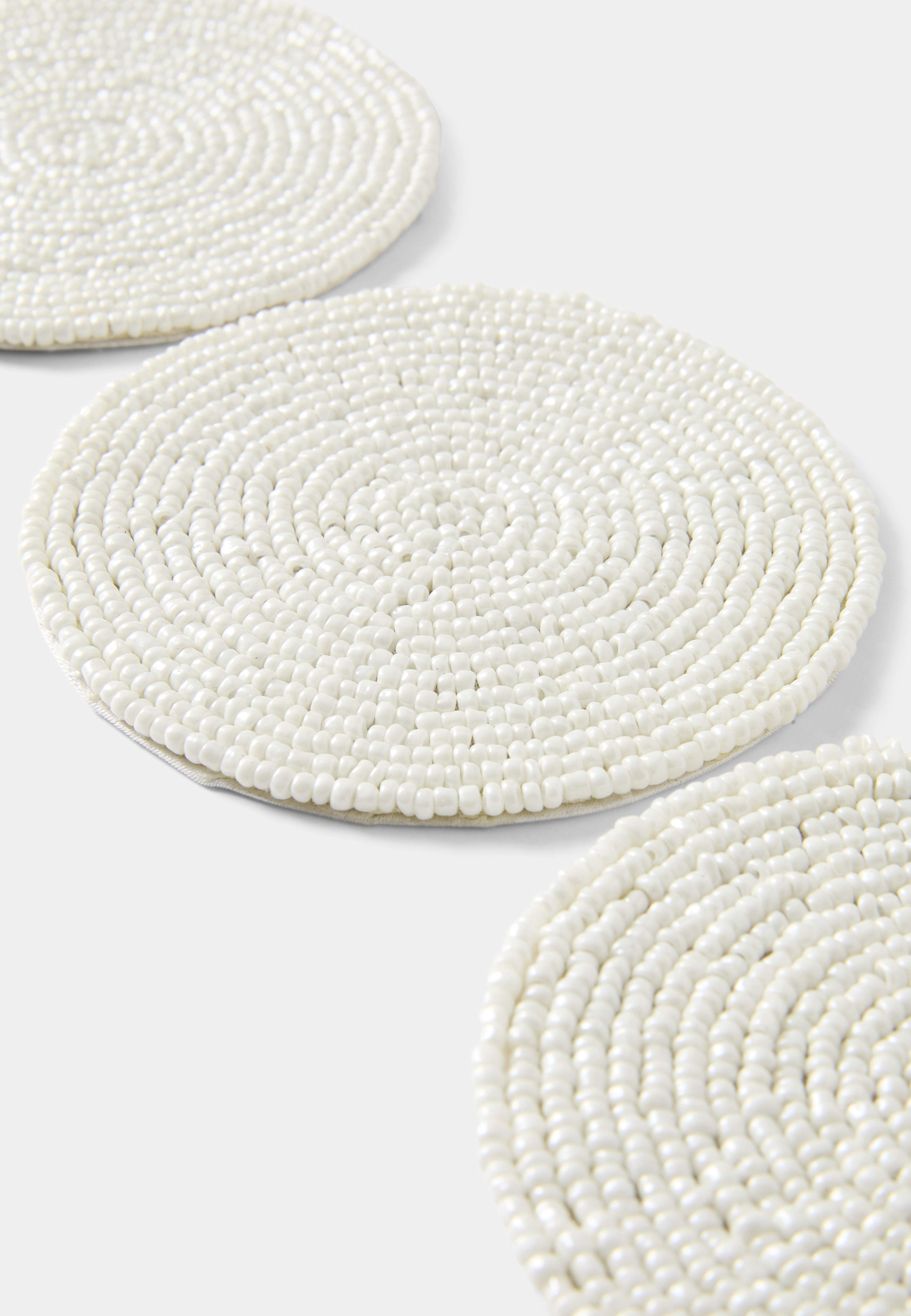 Glasunderlägg BEADS, 4-pack, från Åhléns Home, i färgen White. Klicka för att öppna bilden i stort format