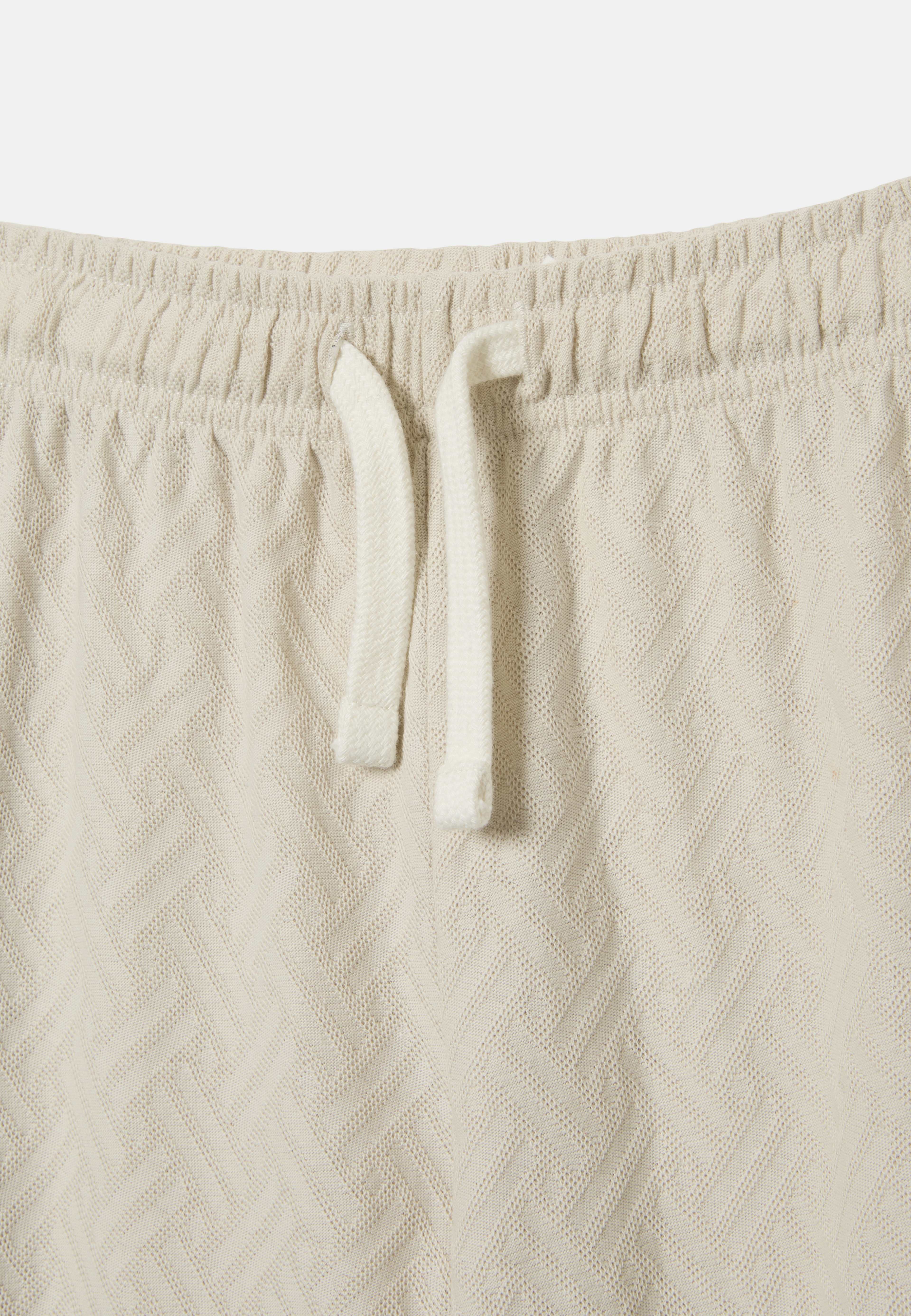 Byxor OTIS, från RIKIKI, i färgen Light Beige. Klicka för att öppna bilden i stort format