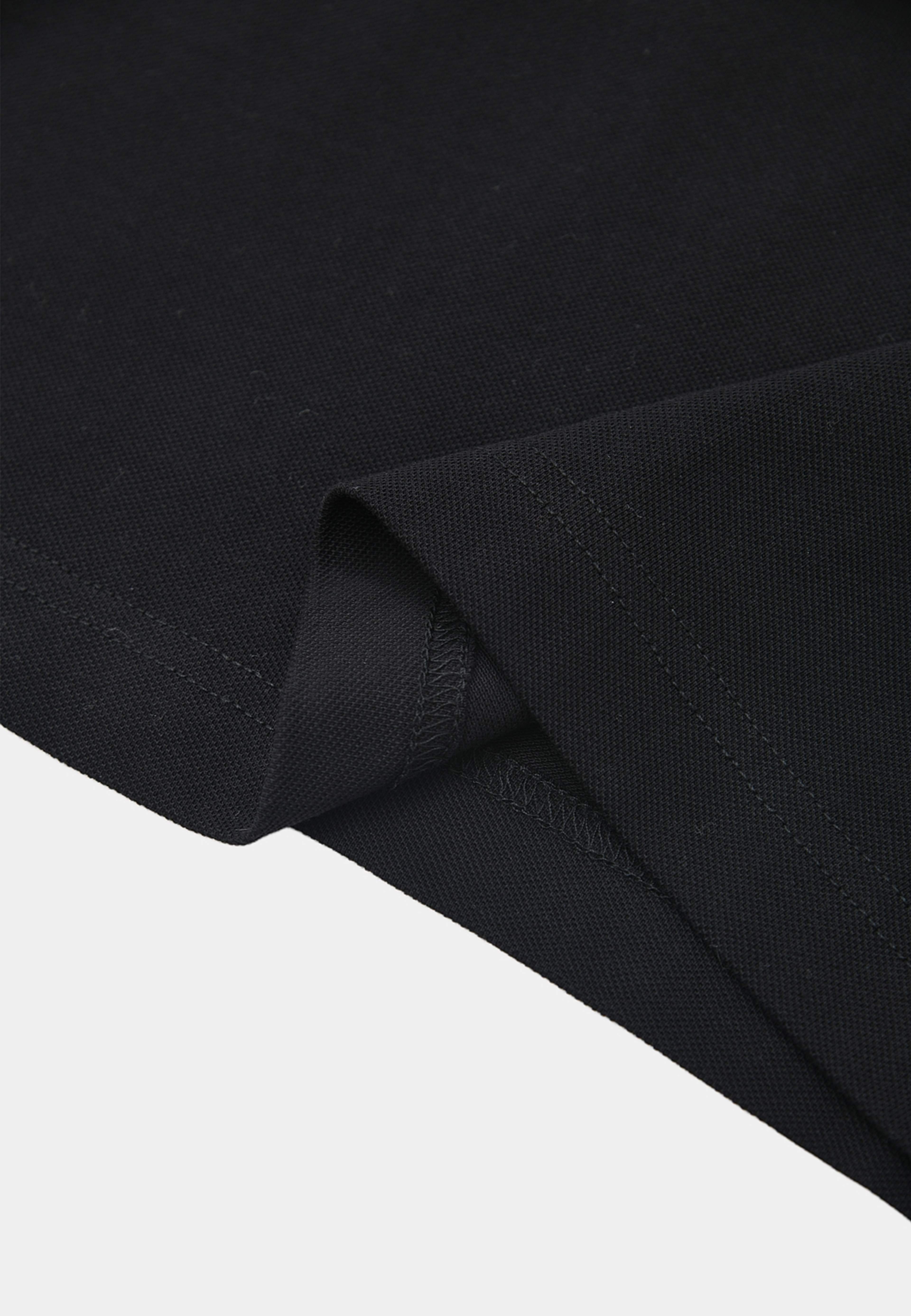 Pikétröja IMMI, från Carin Wester, i färgen Black. Klicka för att öppna bilden i stort format